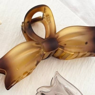 Shop Large Bow Tie Hair Claw Clips-Tortoise at Ruby Joy Boutique, a Women's Clothing Store in Pickerington, Ohio