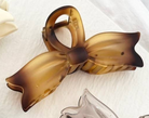 Shop Large Bow Tie Hair Claw Clips-Tortoise at Ruby Joy Boutique, a Women's Clothing Store in Pickerington, Ohio