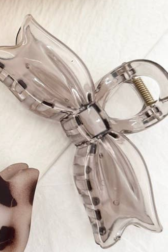 Shop Large Bow Tie Hair Claw Clips-Clear Brown at Ruby Joy Boutique, a Women's Clothing Store in Pickerington, Ohio