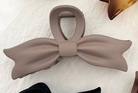 Shop Large Bow Tie Hair Claw Clips-Brown at Ruby Joy Boutique, a Women's Clothing Store in Pickerington, Ohio