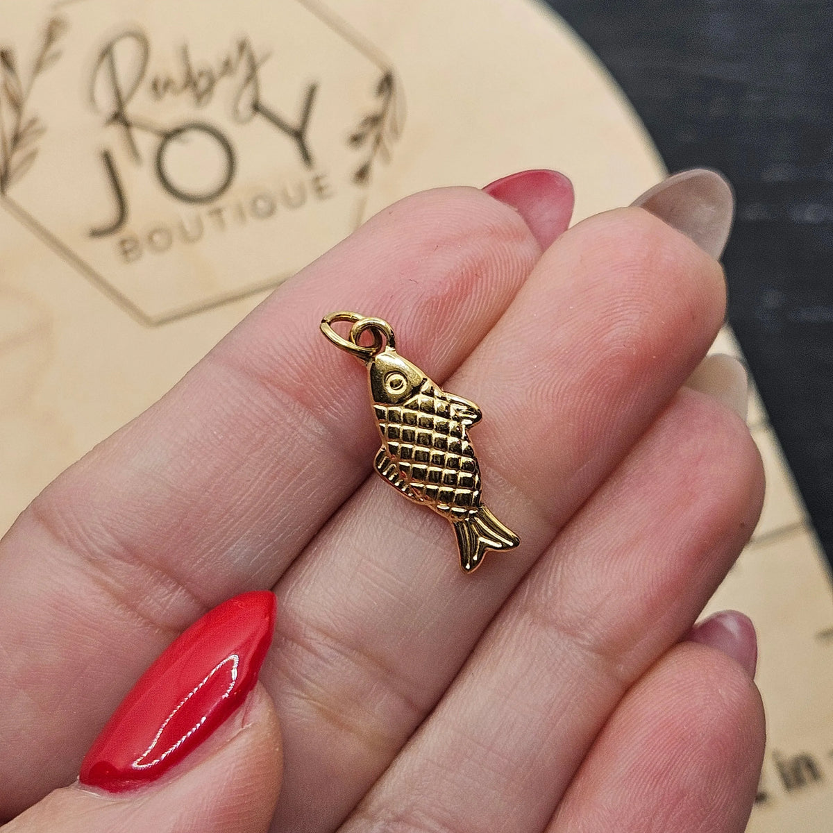 Shop Lucky Fish Charm- at Ruby Joy Boutique, a Women's Clothing Store in Pickerington, Ohio