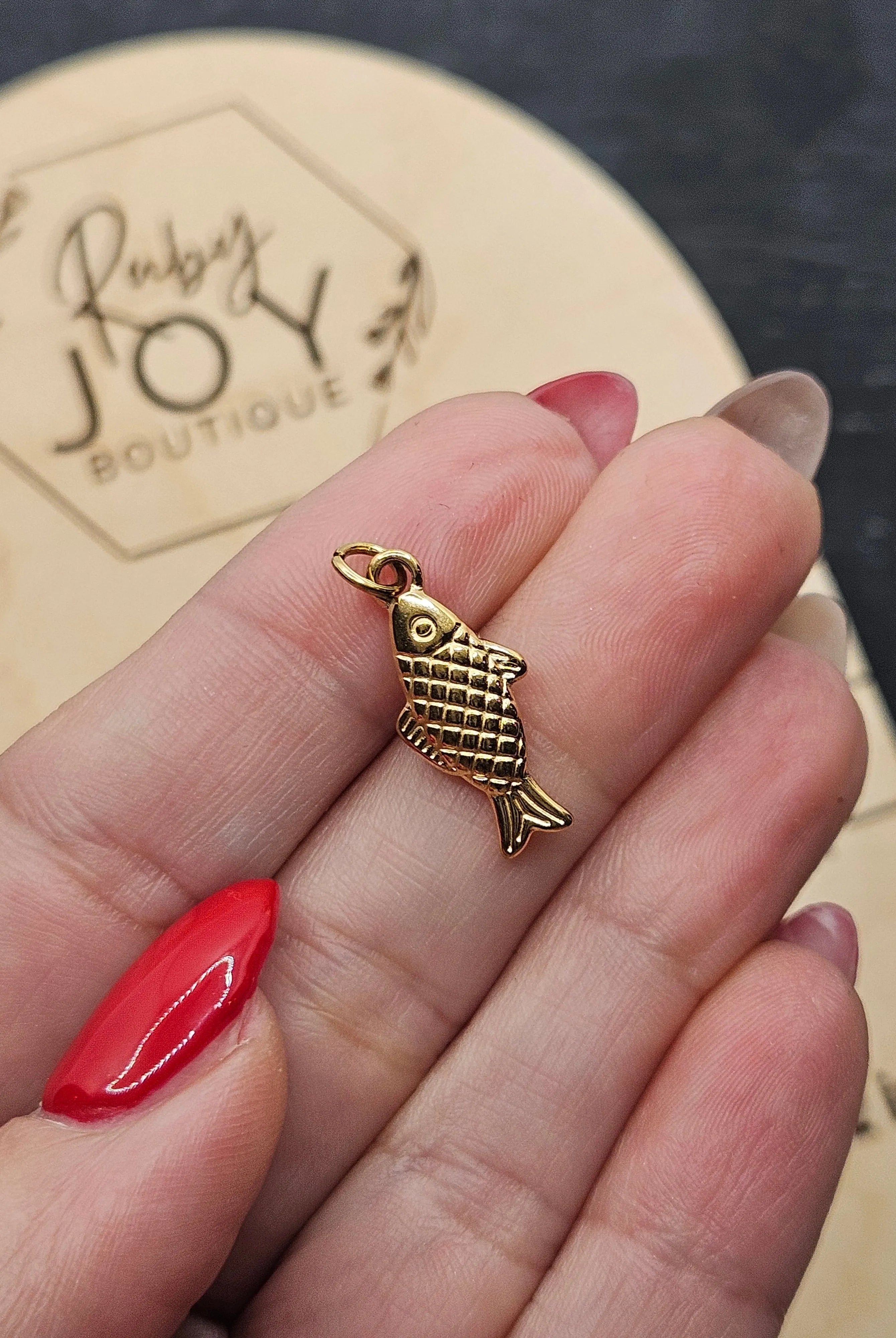 Shop Lucky Fish Charm- at Ruby Joy Boutique, a Women's Clothing Store in Pickerington, Ohio