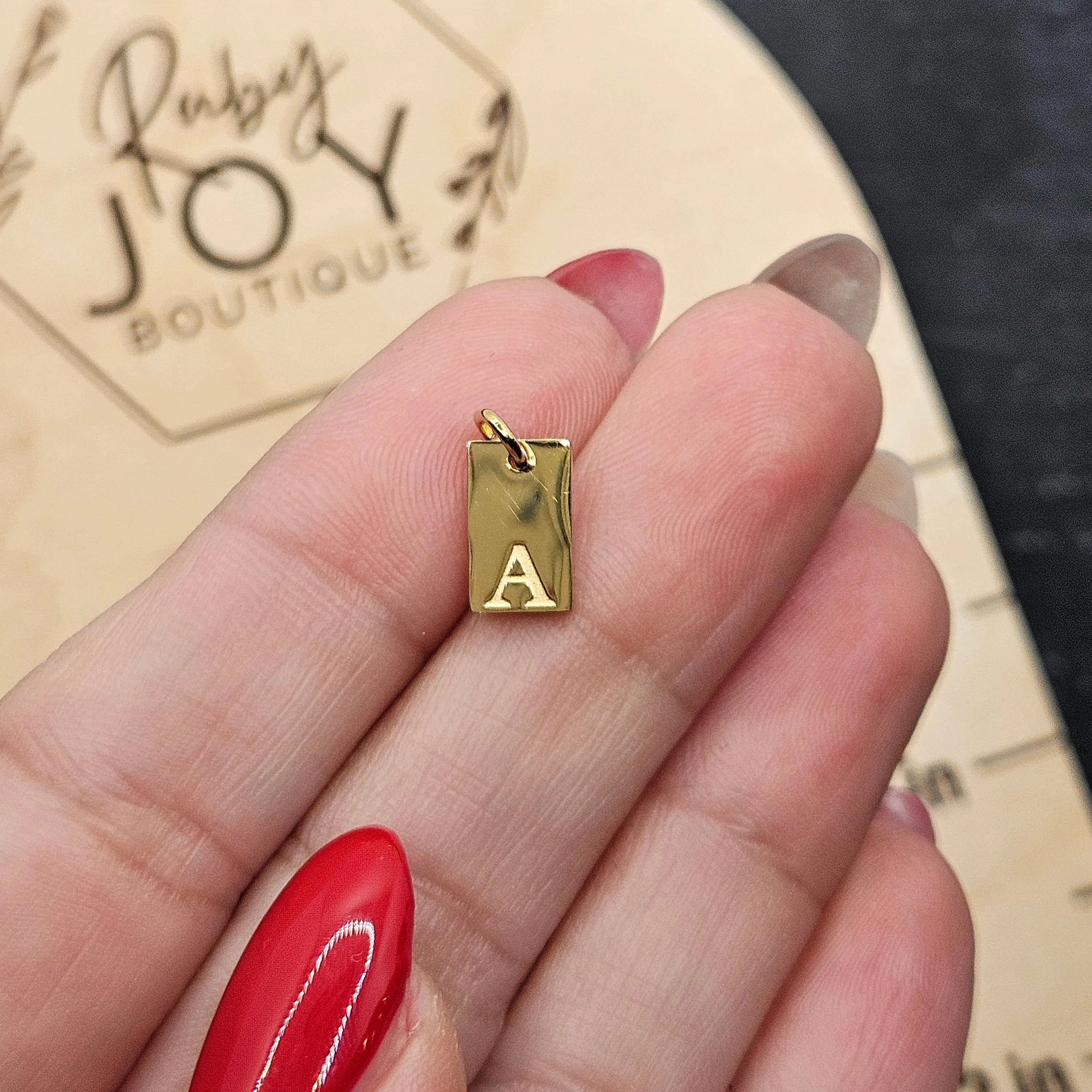 Shop Luxe Initial Tag Charms-A at Ruby Joy Boutique, a Women's Clothing Store in Pickerington, Ohio