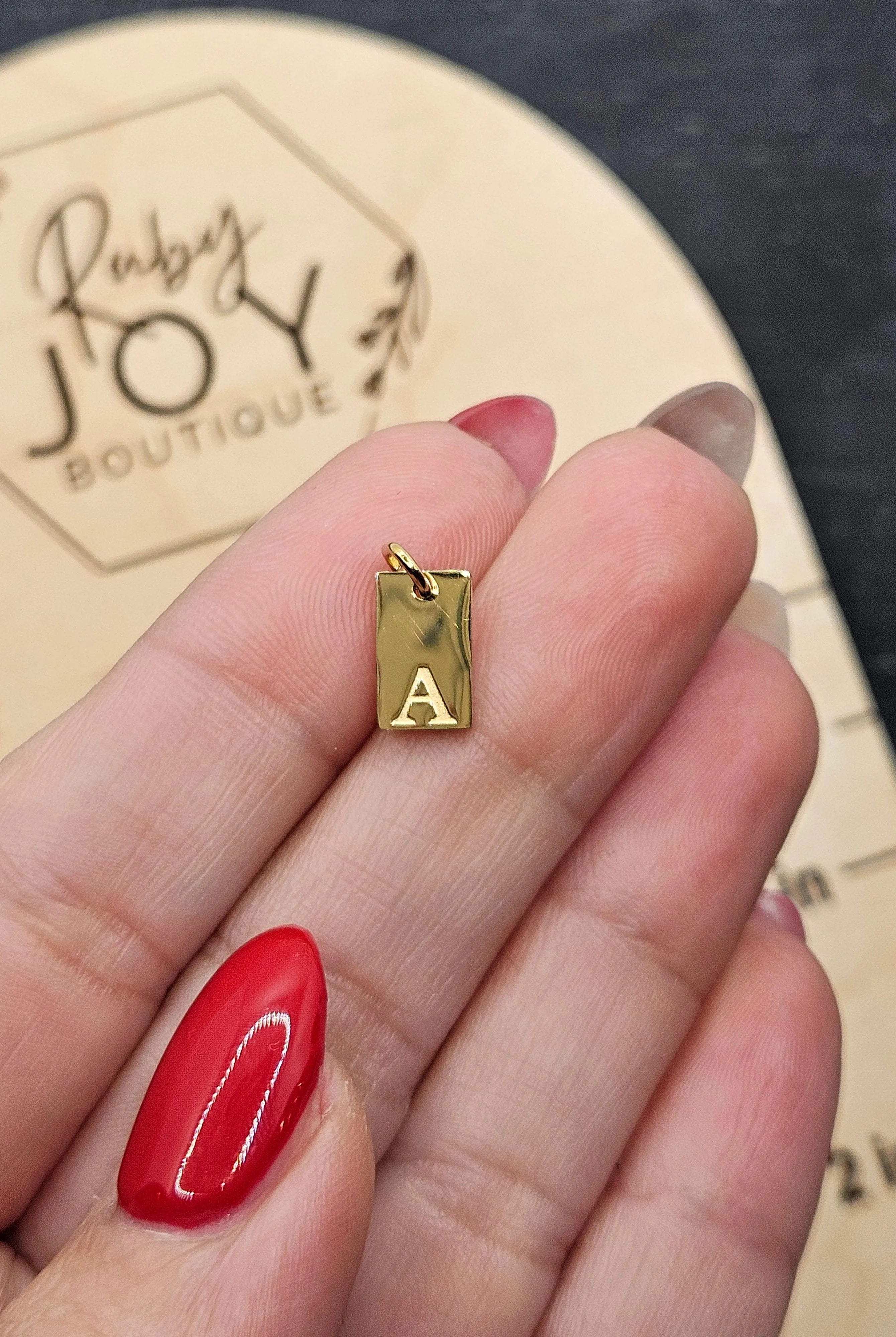 Shop Luxe Initial Tag Charms-A at Ruby Joy Boutique, a Women's Clothing Store in Pickerington, Ohio