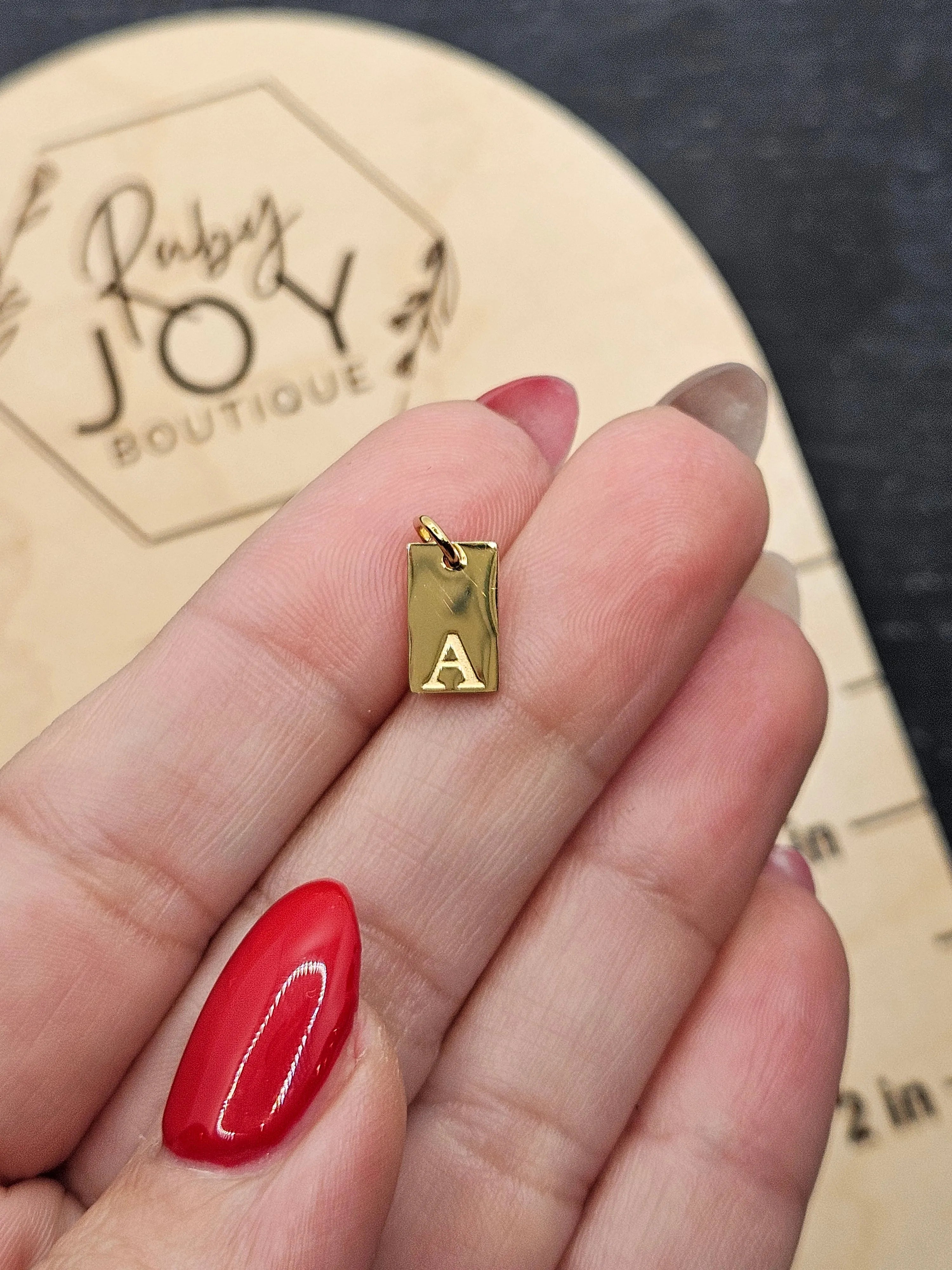 Shop Luxe Initial Tag Charms-A at Ruby Joy Boutique, a Women's Clothing Store in Pickerington, Ohio