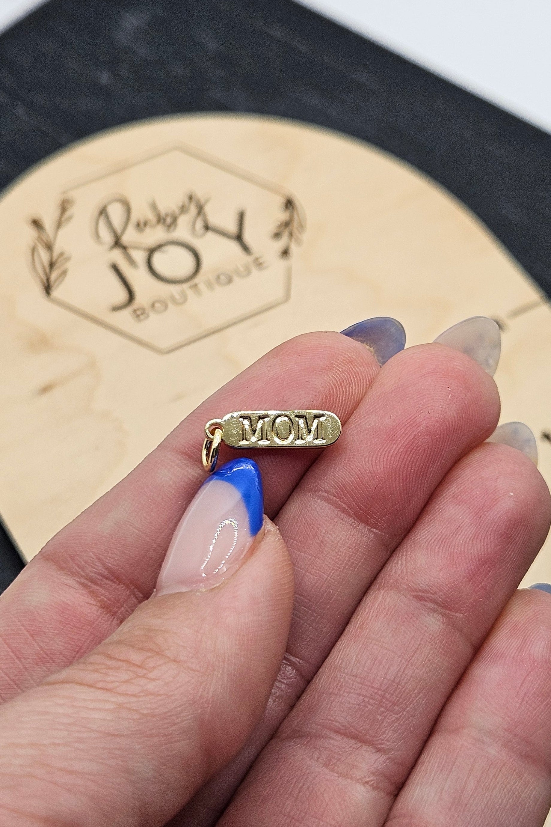 Shop "MOM" Mini Tag Charm- at Ruby Joy Boutique, a Women's Clothing Store in Pickerington, Ohio