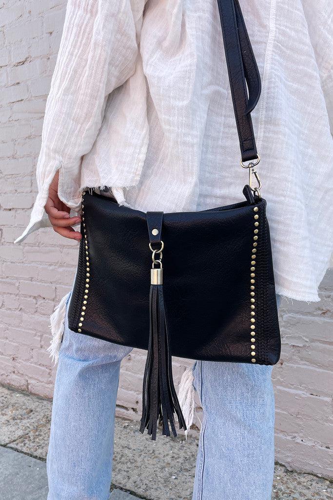Shop Marie Crossbody with Grommet Details and Tassel-Purse at Ruby Joy Boutique, a Women's Clothing Store in Pickerington, Ohio