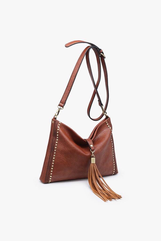 Shop Marie Crossbody with Grommet Details and Tassel-Purse at Ruby Joy Boutique, a Women's Clothing Store in Pickerington, Ohio