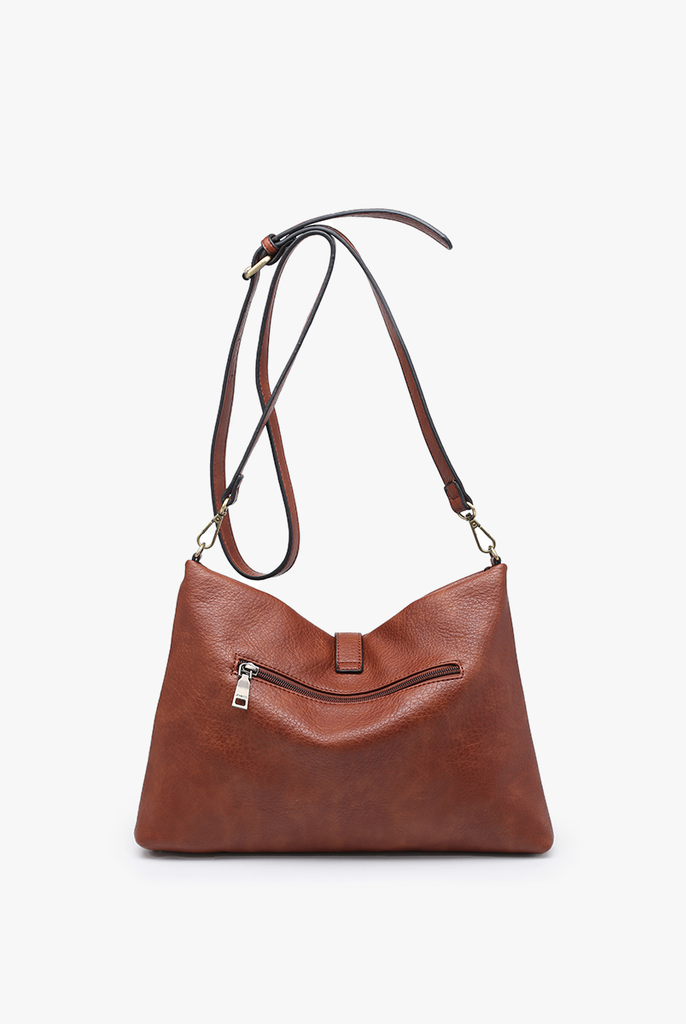 Shop Marie Crossbody with Grommet Details and Tassel-Purse at Ruby Joy Boutique, a Women's Clothing Store in Pickerington, Ohio