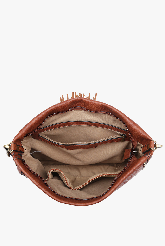 Shop Marie Crossbody with Grommet Details and Tassel-Purse at Ruby Joy Boutique, a Women's Clothing Store in Pickerington, Ohio