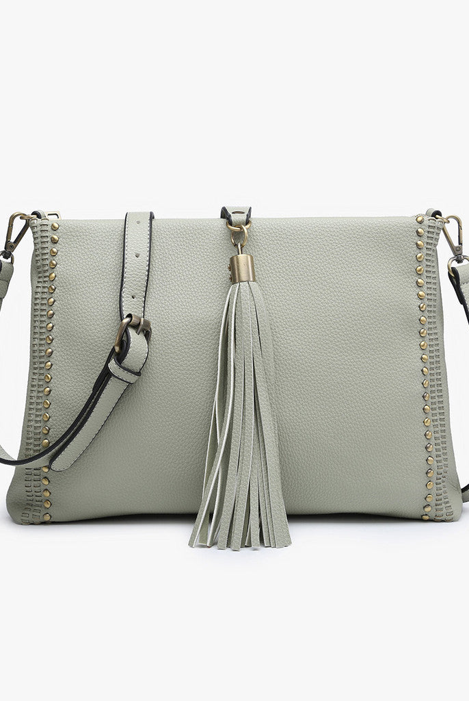 Shop Marie Crossbody with Grommet Details and Tassel-Purse at Ruby Joy Boutique, a Women's Clothing Store in Pickerington, Ohio
