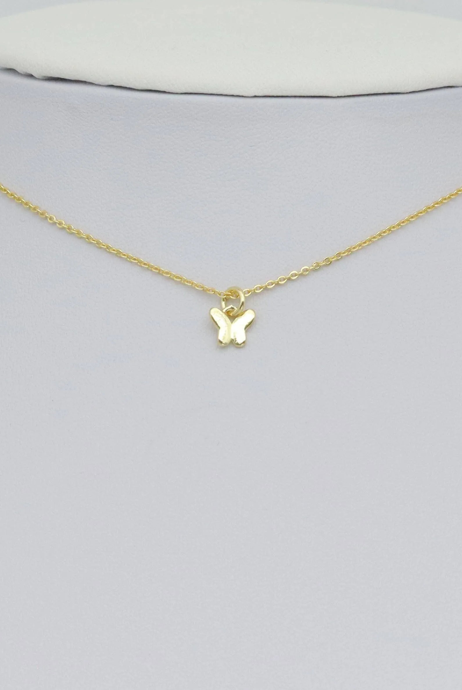 Shop Mini Gold Butterfly Charm- at Ruby Joy Boutique, a Women's Clothing Store in Pickerington, Ohio