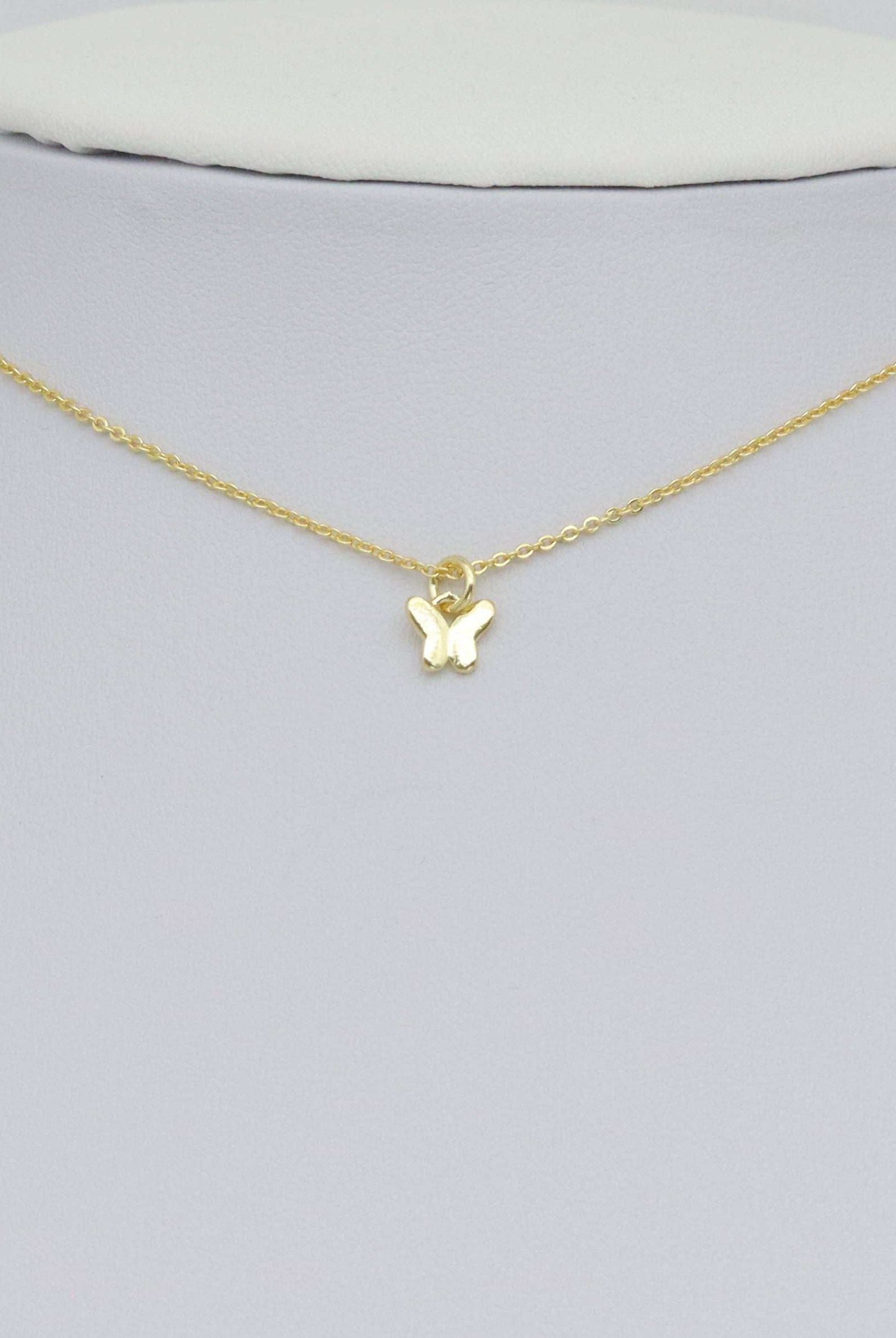 Shop Mini Gold Butterfly Charm- at Ruby Joy Boutique, a Women's Clothing Store in Pickerington, Ohio