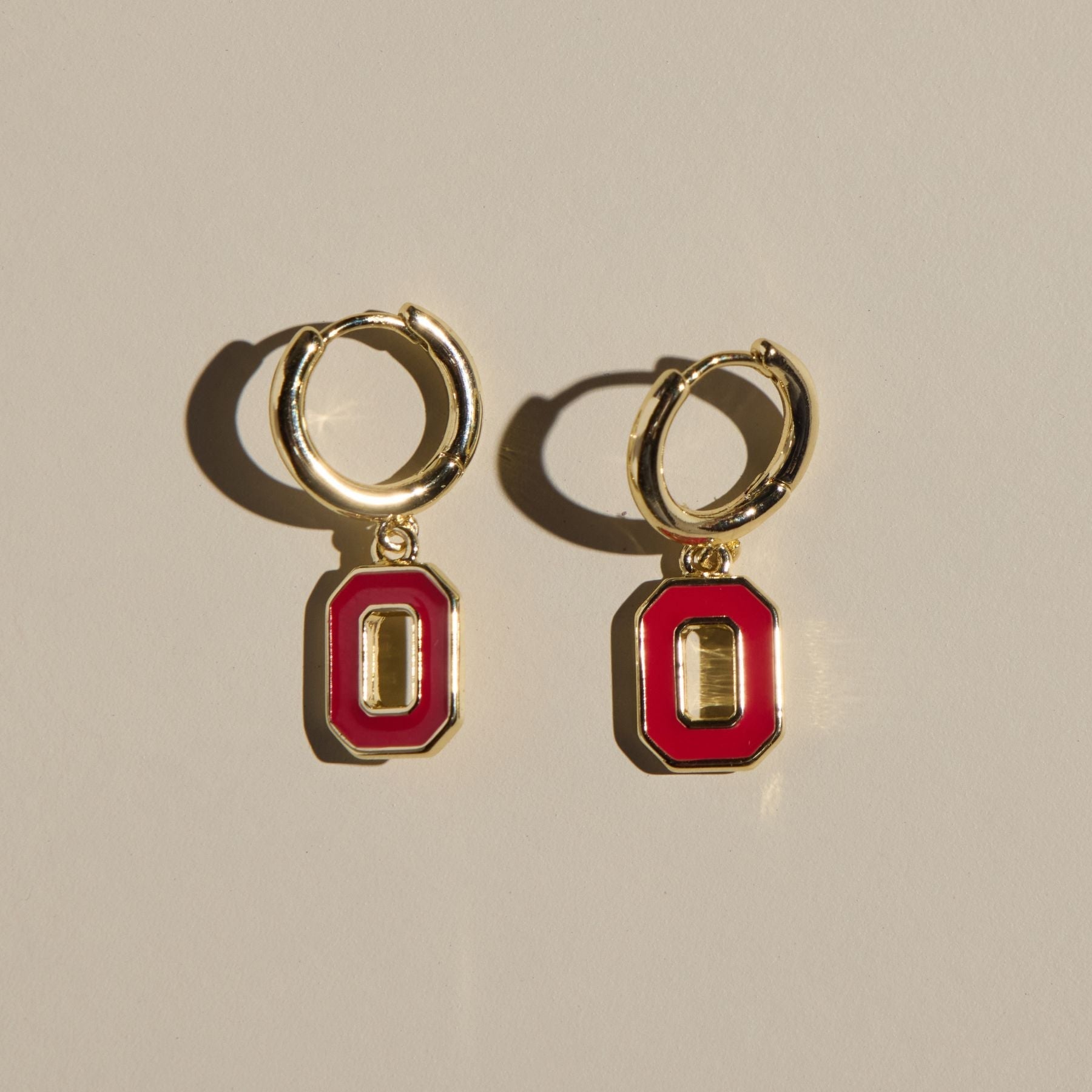 Shop Ohio State University Logo Charm Huggie Earrings- at Ruby Joy Boutique, a Women's Clothing Store in Pickerington, Ohio