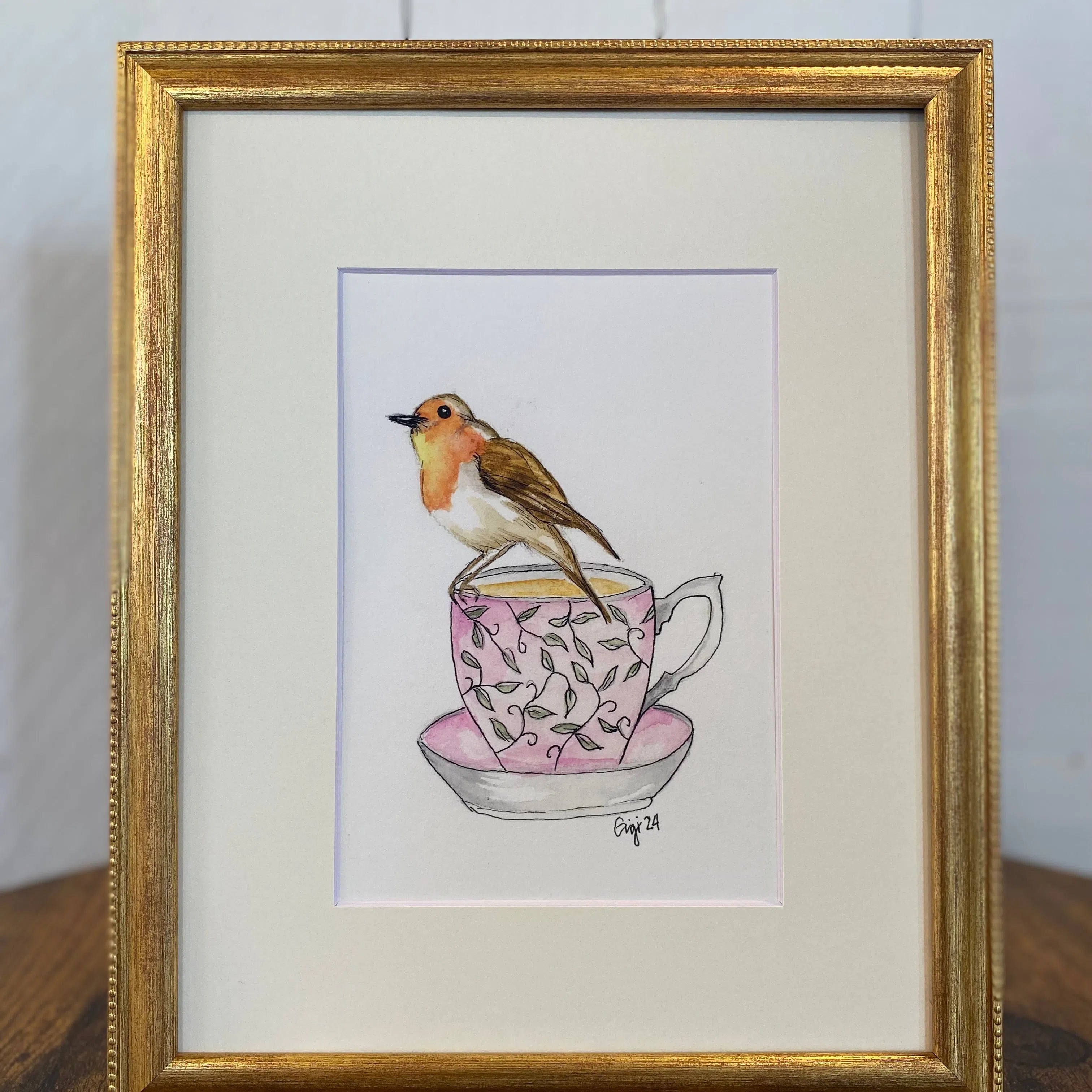 Shop Original Watercolor Prints-Robin on a Teacup at Ruby Joy Boutique, a Women's Clothing Store in Pickerington, Ohio