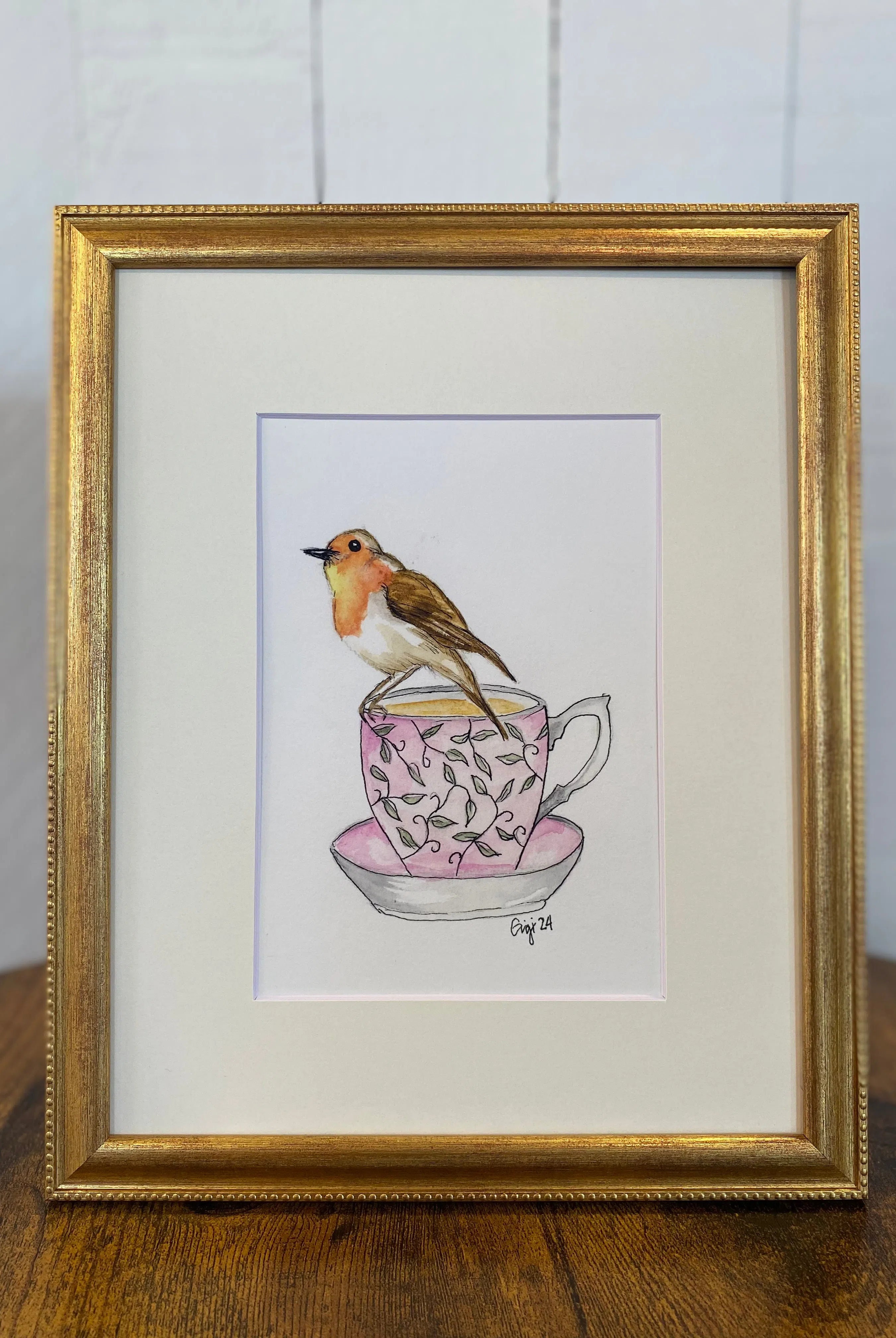 Shop Original Watercolor Prints-Robin on a Teacup at Ruby Joy Boutique, a Women's Clothing Store in Pickerington, Ohio