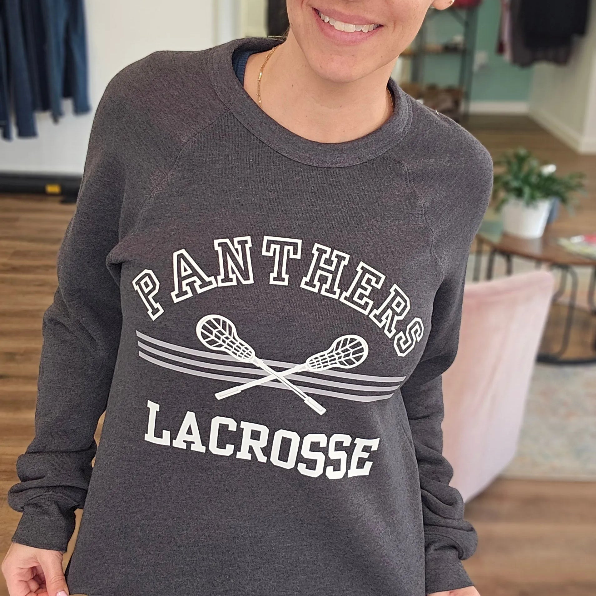 Shop Panthers Lacrosse Arch Graphic Top- at Ruby Joy Boutique, a Women's Clothing Store in Pickerington, Ohio