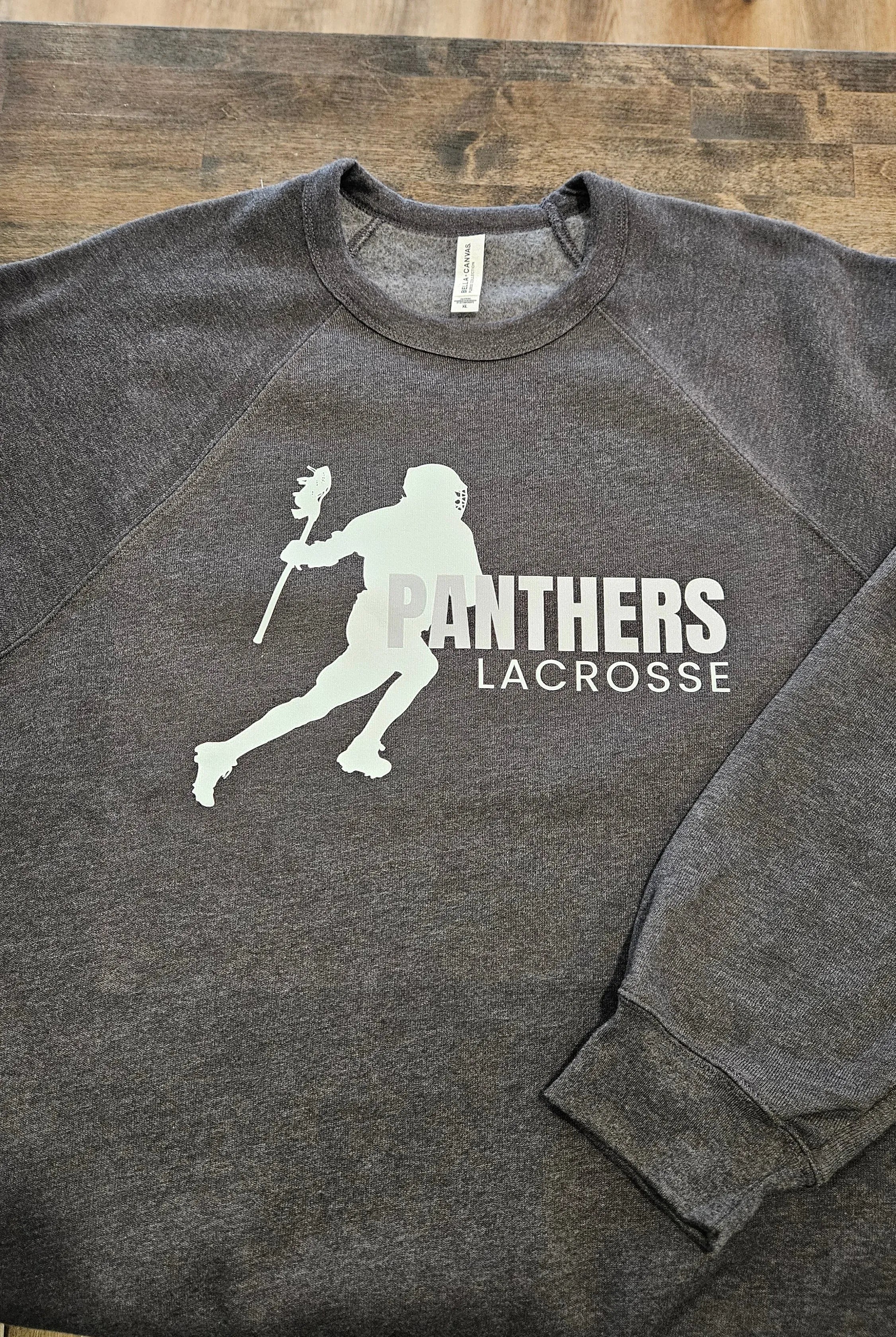 Shop Panthers Lacrosse Player Graphic- at Ruby Joy Boutique, a Women's Clothing Store in Pickerington, Ohio