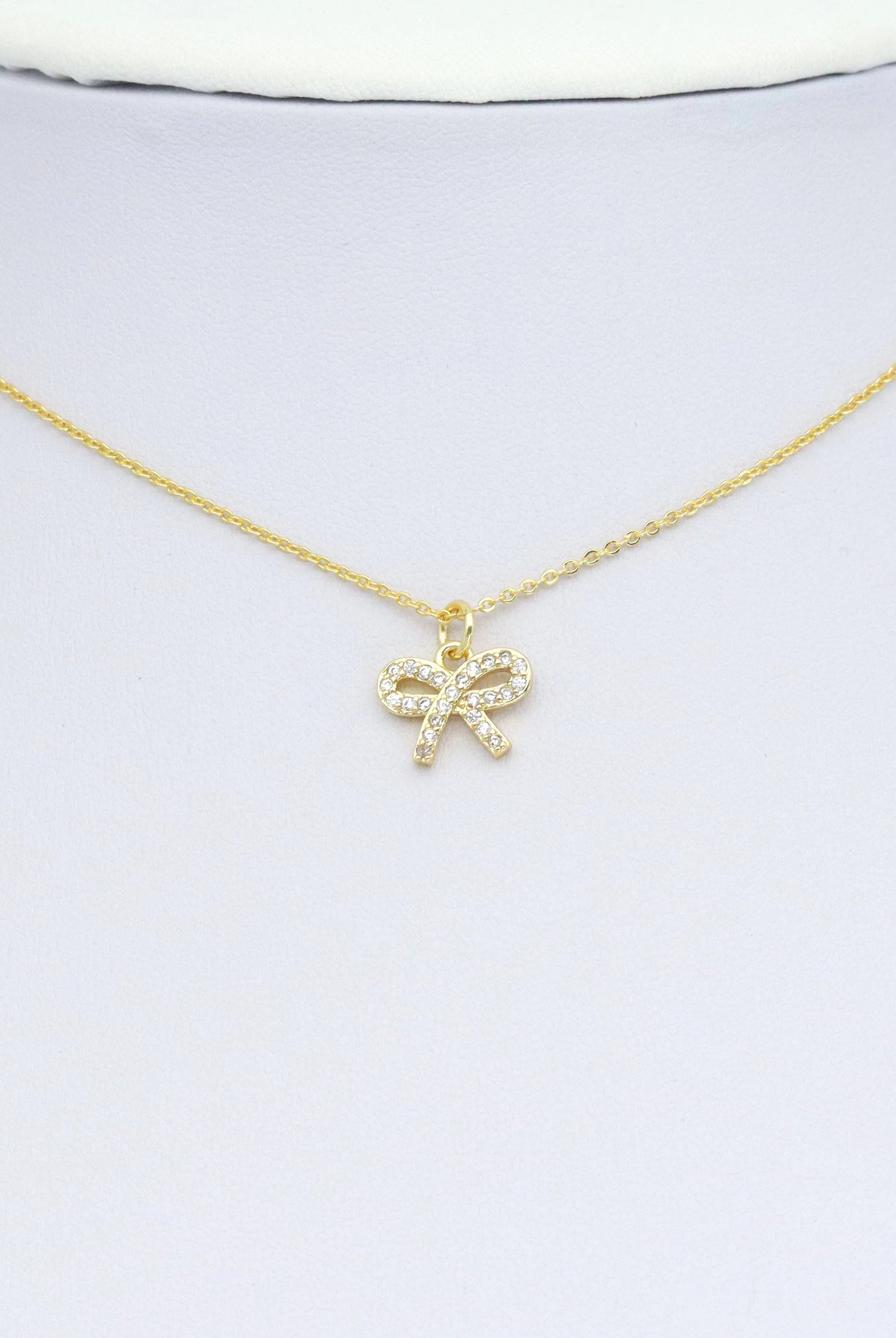 Shop Pave Bow Charm Pendant- at Ruby Joy Boutique, a Women's Clothing Store in Pickerington, Ohio