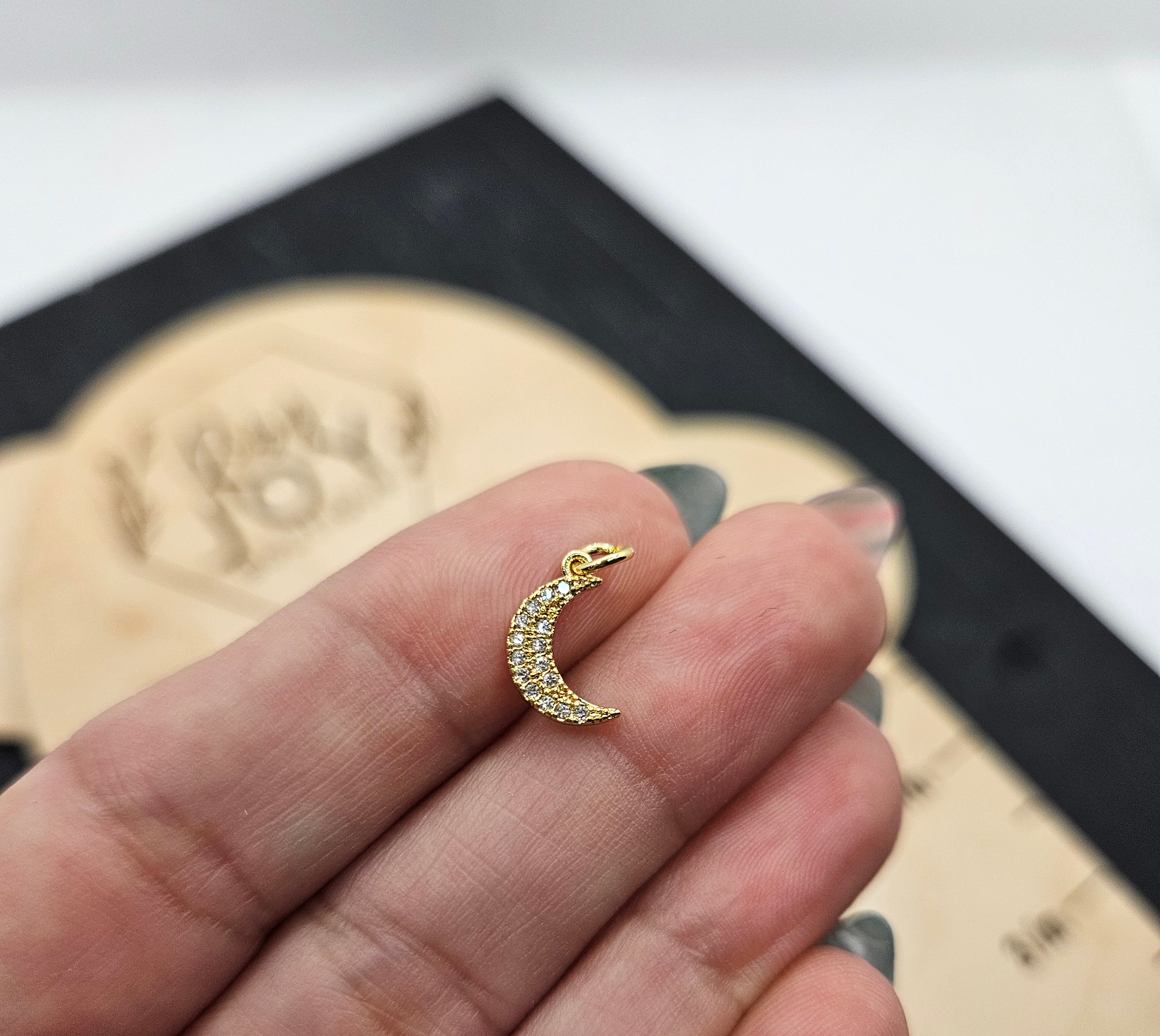 Shop Pave Crescent Moon Charm- at Ruby Joy Boutique, a Women's Clothing Store in Pickerington, Ohio