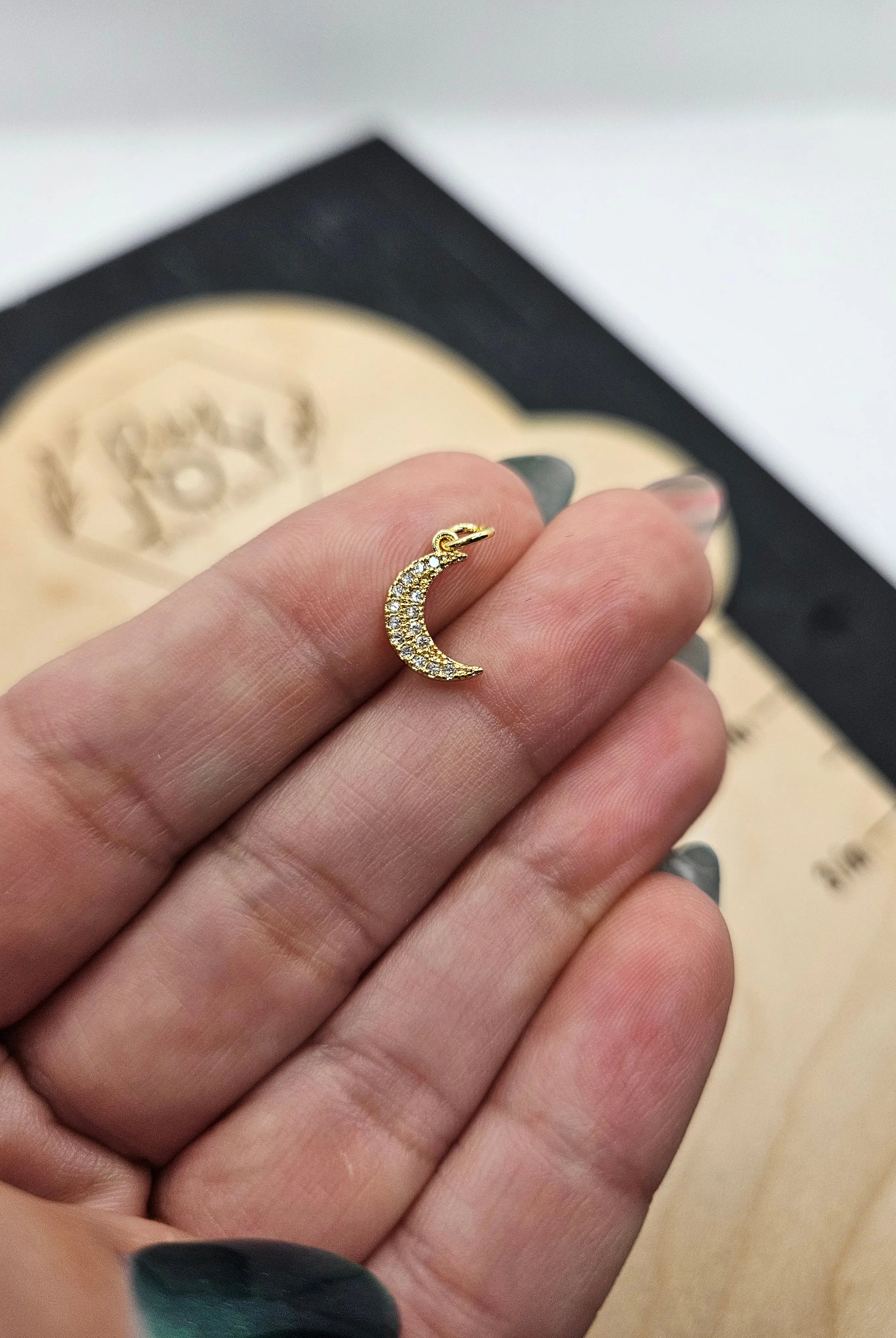 Shop Pave Crescent Moon Charm- at Ruby Joy Boutique, a Women's Clothing Store in Pickerington, Ohio