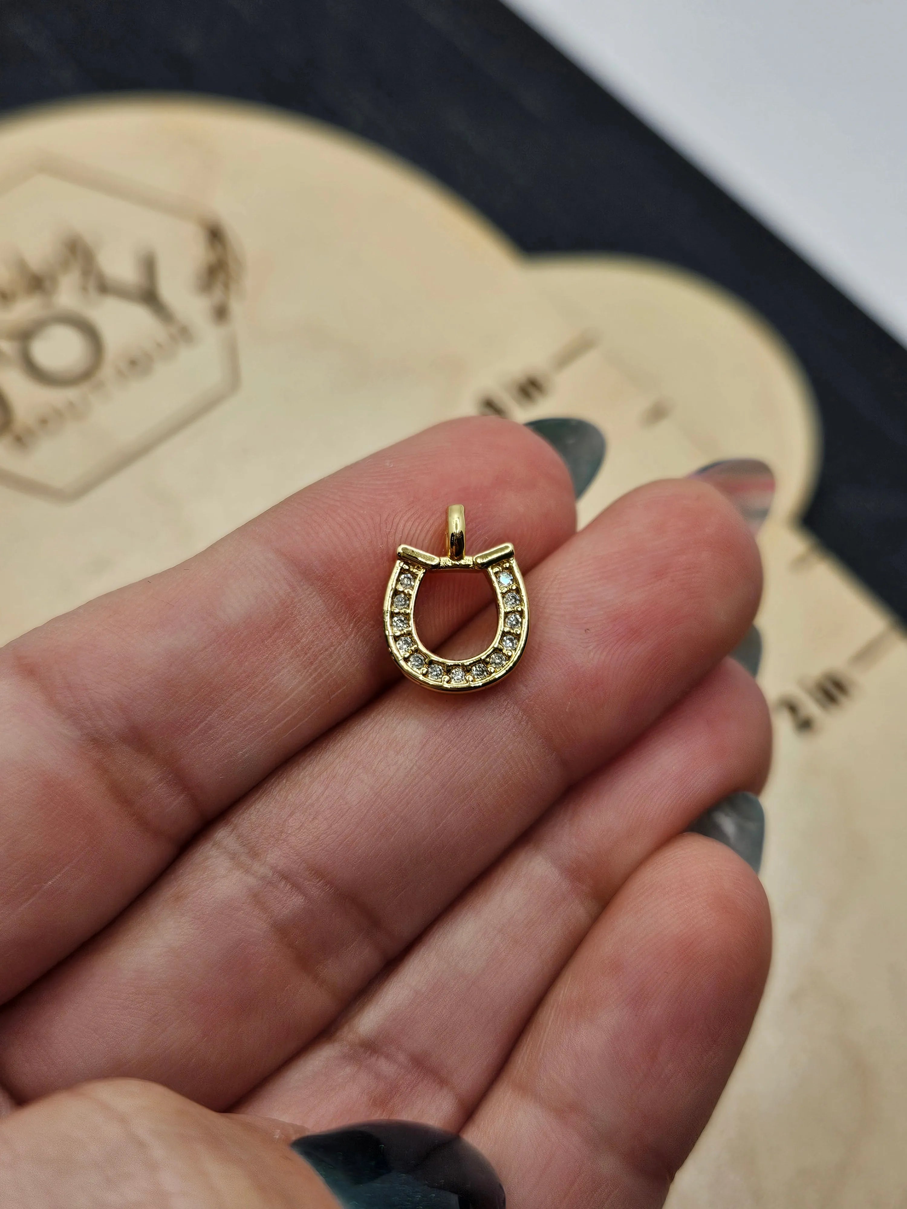 Shop Pave Horseshoe Charm- at Ruby Joy Boutique, a Women's Clothing Store in Pickerington, Ohio