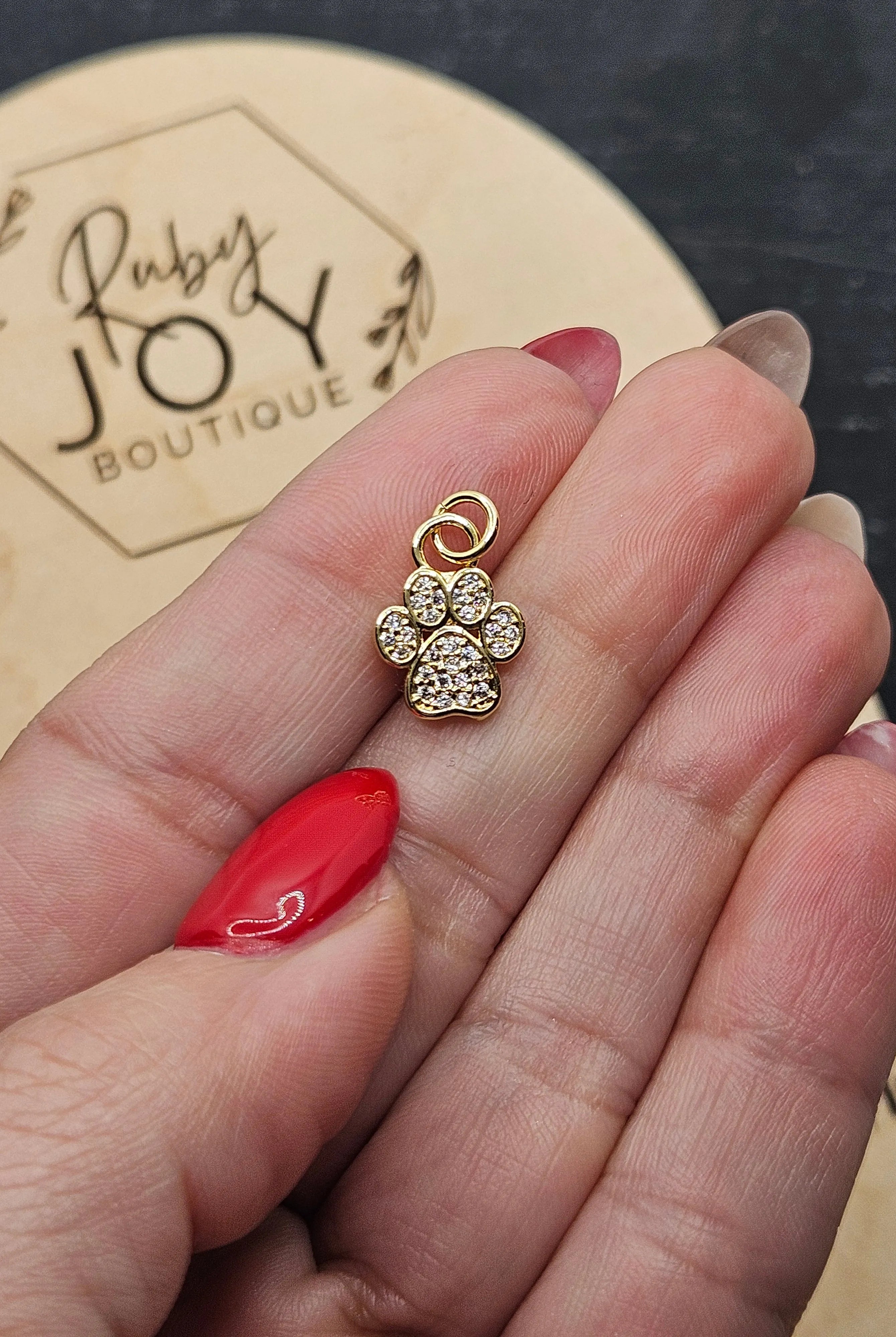 Shop Paw Print Charm- at Ruby Joy Boutique, a Women's Clothing Store in Pickerington, Ohio