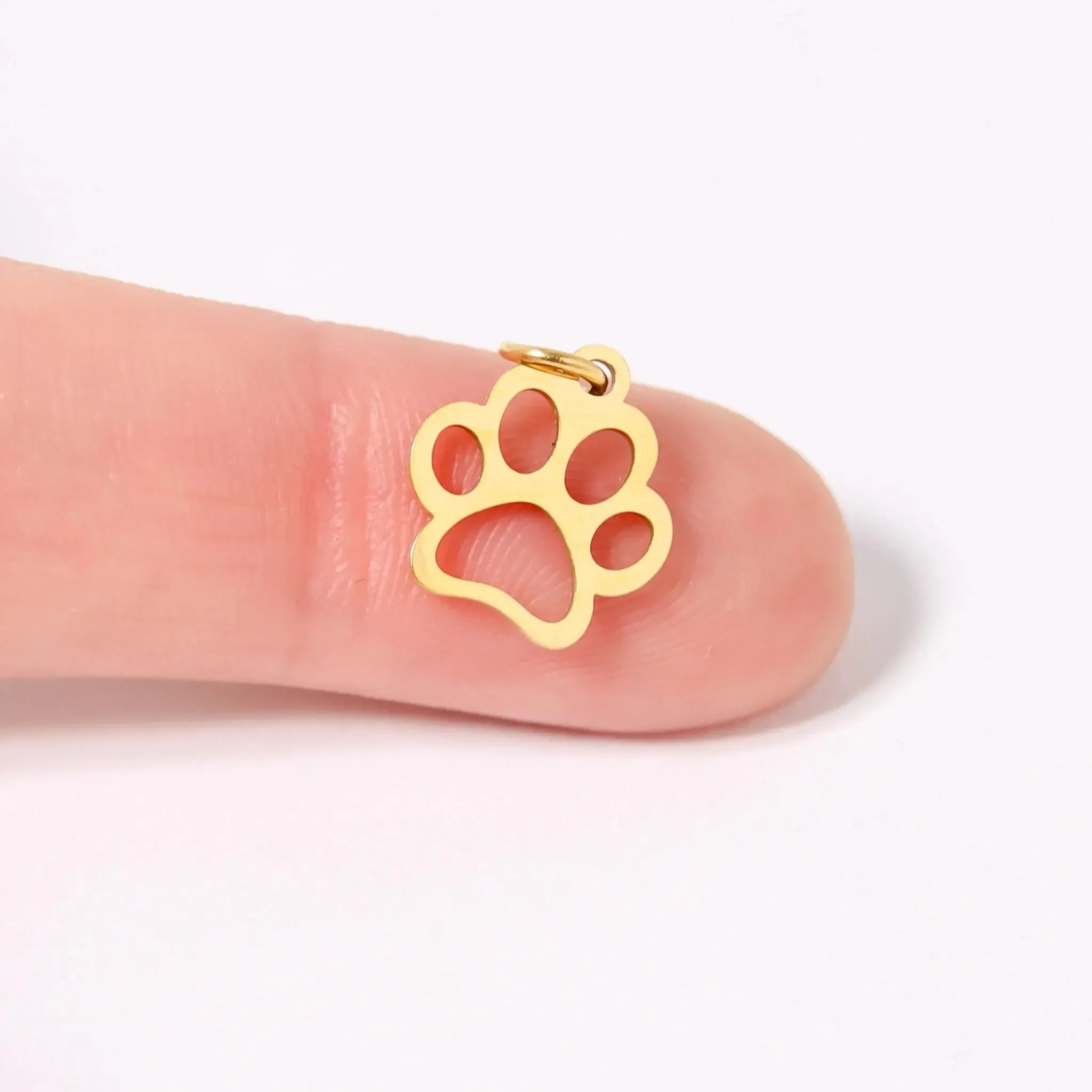 Shop Paw Print Outline Charm- at Ruby Joy Boutique, a Women's Clothing Store in Pickerington, Ohio
