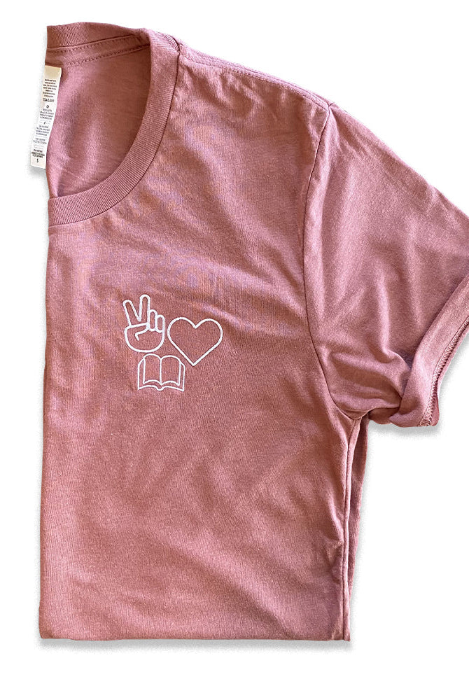 Shop Peace, Love, Books Classic Tee | Kind Cotton- at Ruby Joy Boutique, a Women's Clothing Store in Pickerington, Ohio