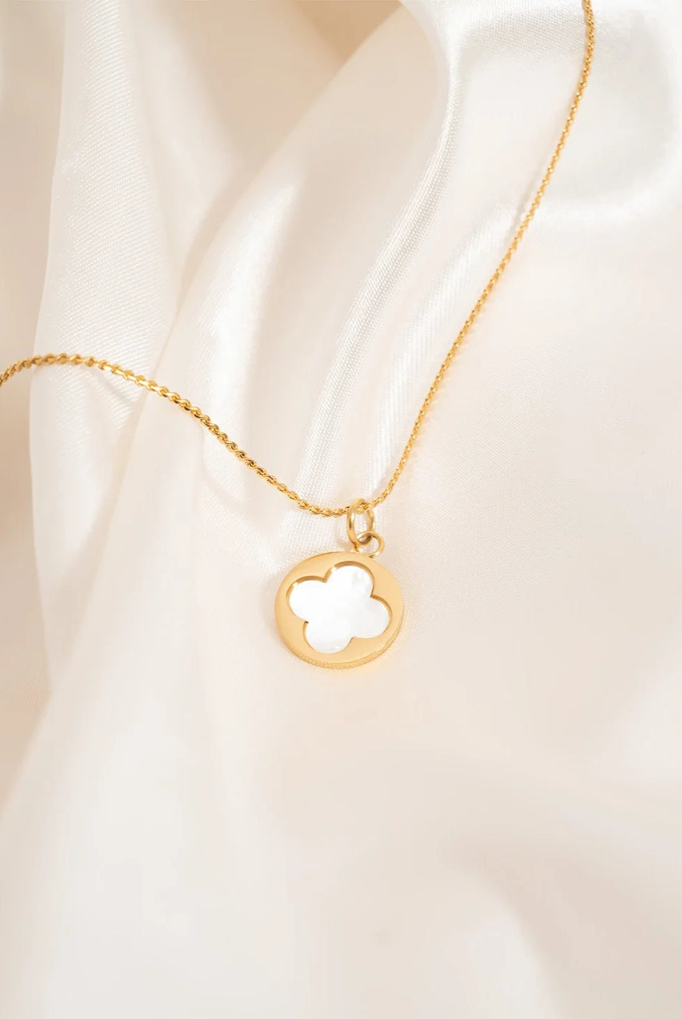 Shop Pearl Quatrefoil Charm- at Ruby Joy Boutique, a Women's Clothing Store in Pickerington, Ohio