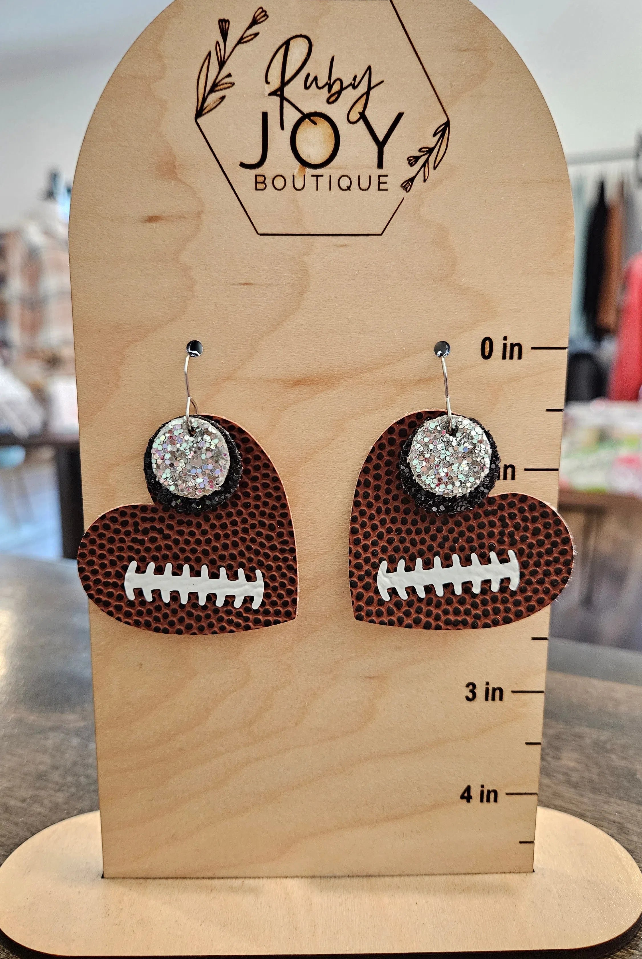 Shop Pickerington Sparkle Heart Football Earrings-Earrings at Ruby Joy Boutique, a Women's Clothing Store in Pickerington, Ohio