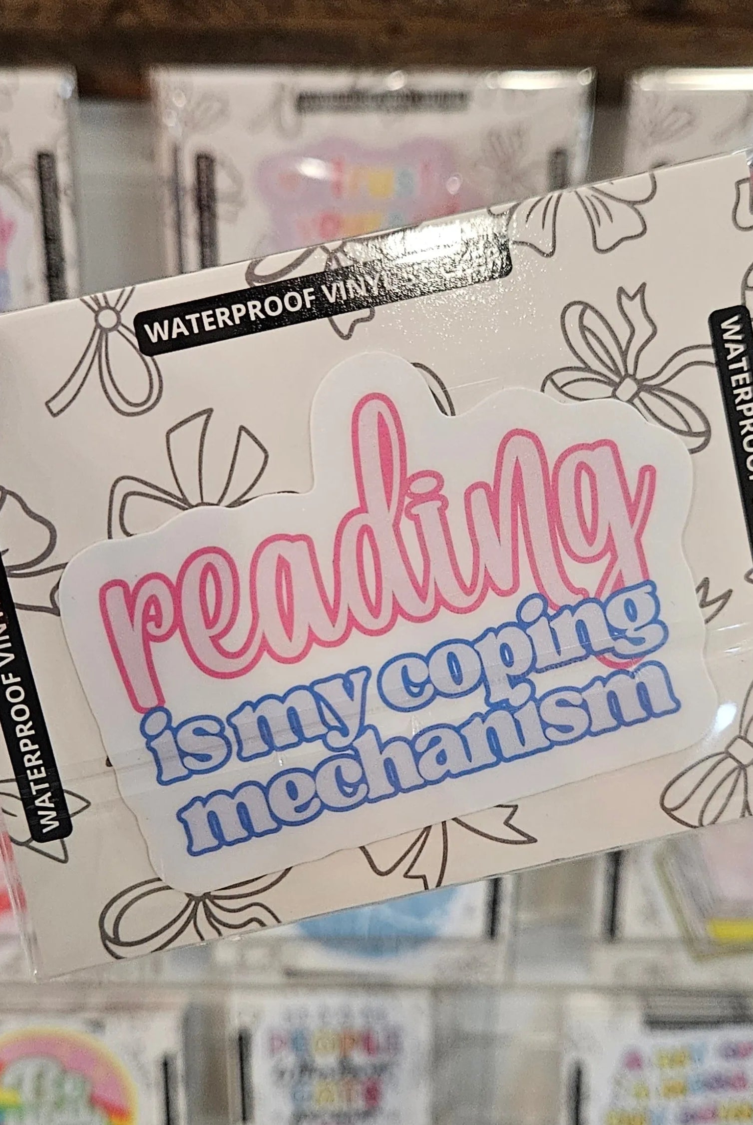Shop Reading is My Coping Mechanism | Waterproof Vinyl Sticker- at Ruby Joy Boutique, a Women's Clothing Store in Pickerington, Ohio