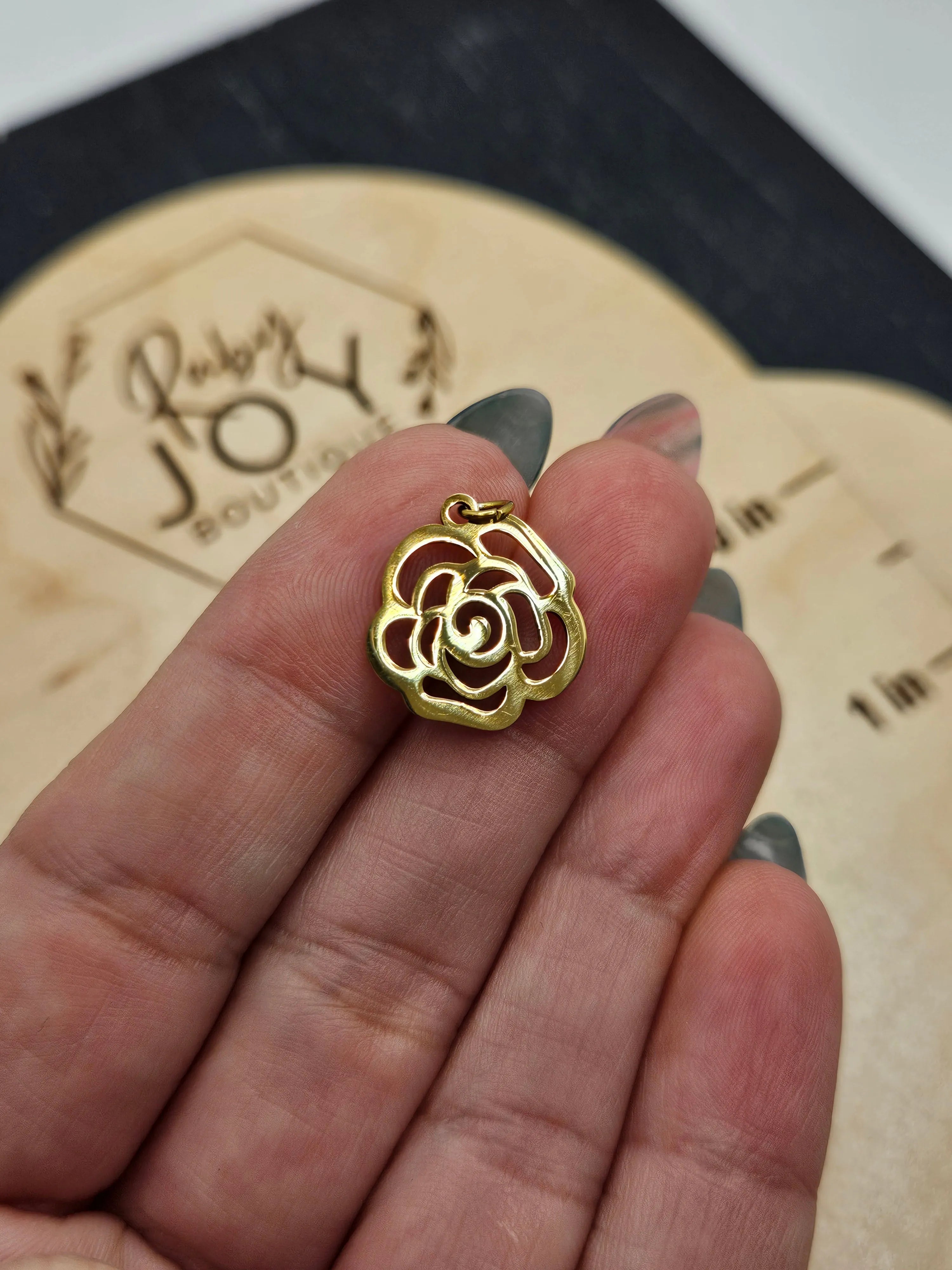 Shop Rose Outline Charm- at Ruby Joy Boutique, a Women's Clothing Store in Pickerington, Ohio