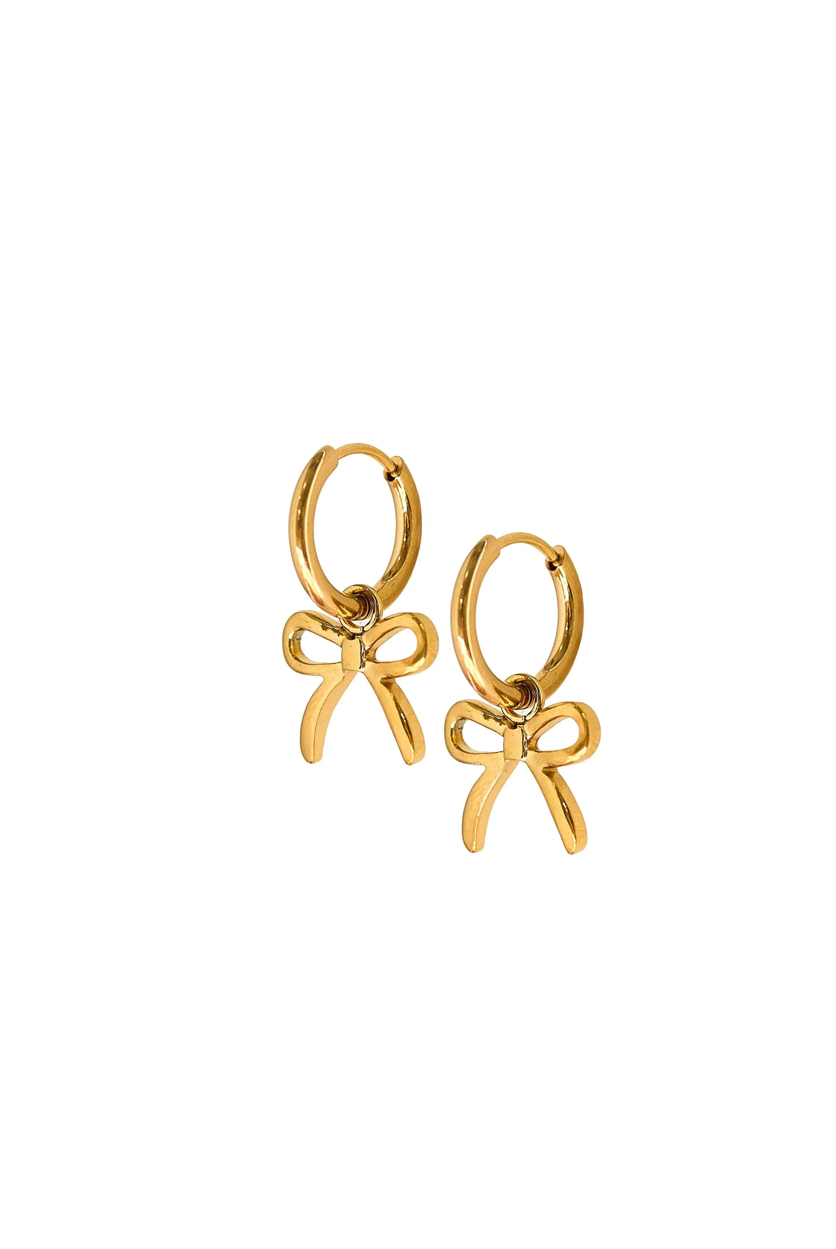 Shop Sadie Bow Huggie Charm Earrings - Gold- at Ruby Joy Boutique, a Women's Clothing Store in Pickerington, Ohio