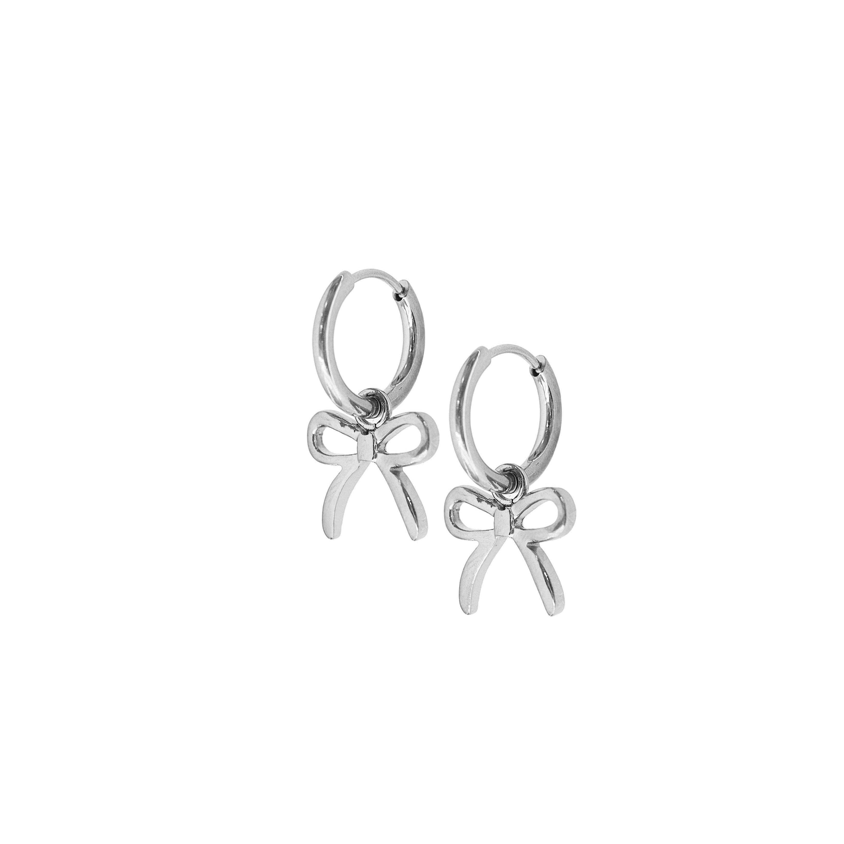 Shop Sadie Bow Huggie Charm Earrings - Silver- at Ruby Joy Boutique, a Women's Clothing Store in Pickerington, Ohio