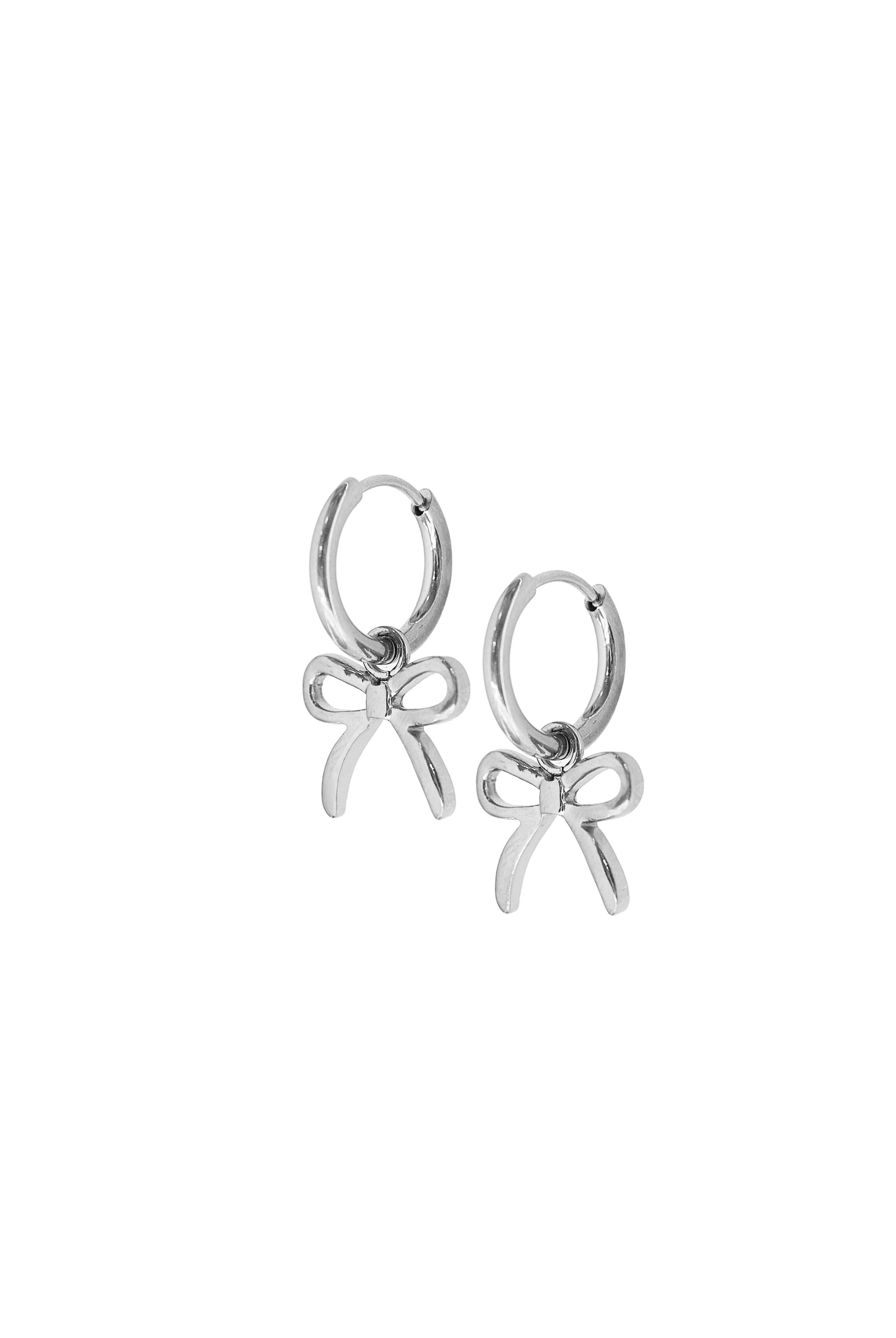 Shop Sadie Bow Huggie Charm Earrings - Silver- at Ruby Joy Boutique, a Women's Clothing Store in Pickerington, Ohio