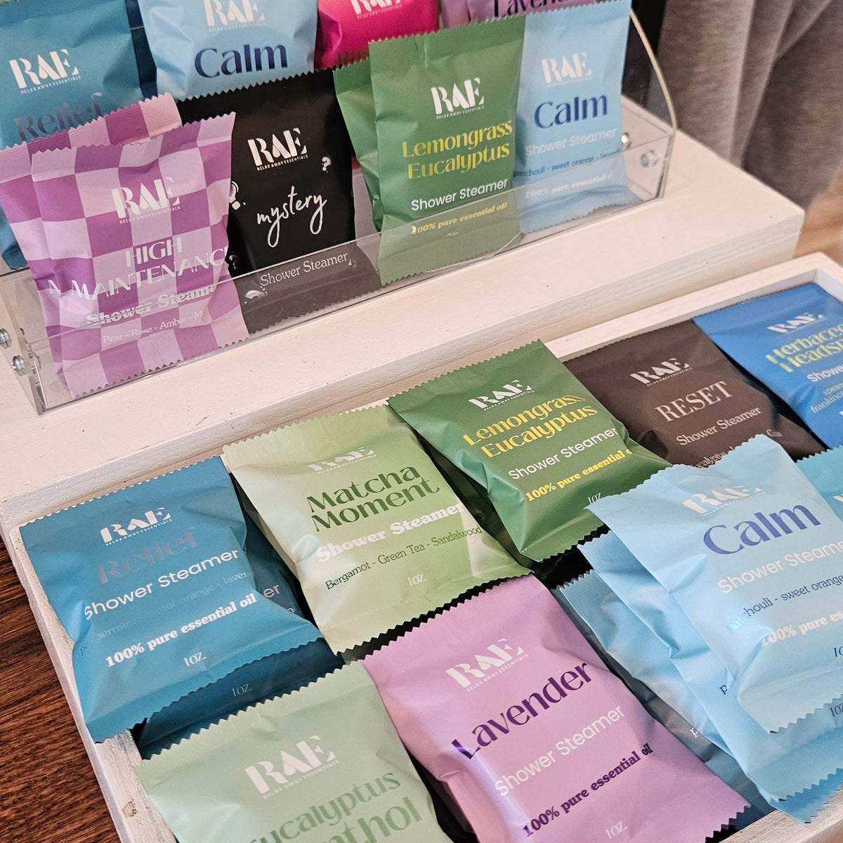A display of RAE shower steamers on a table.