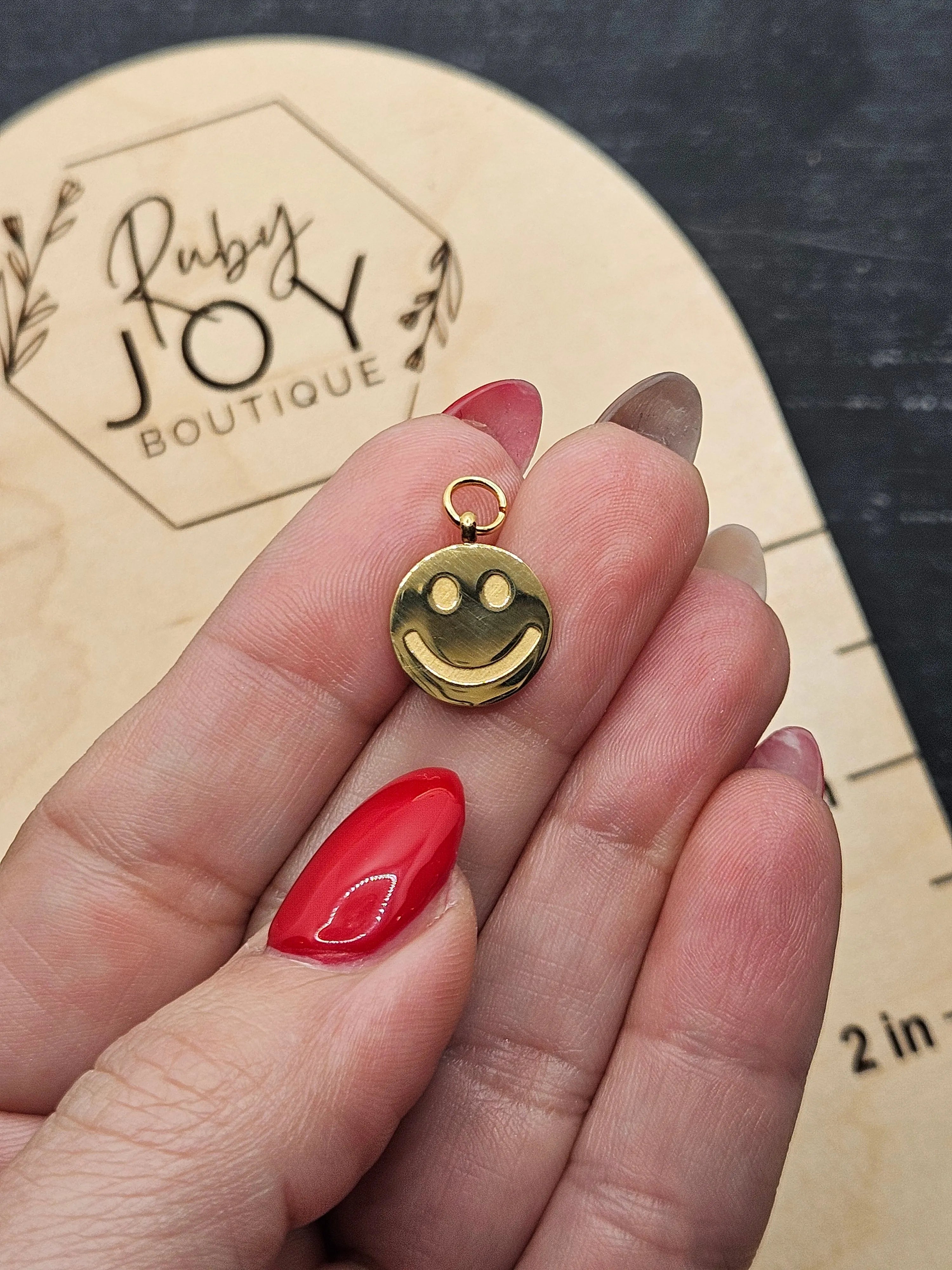 Shop Smile Face Disc Charm- at Ruby Joy Boutique, a Women's Clothing Store in Pickerington, Ohio