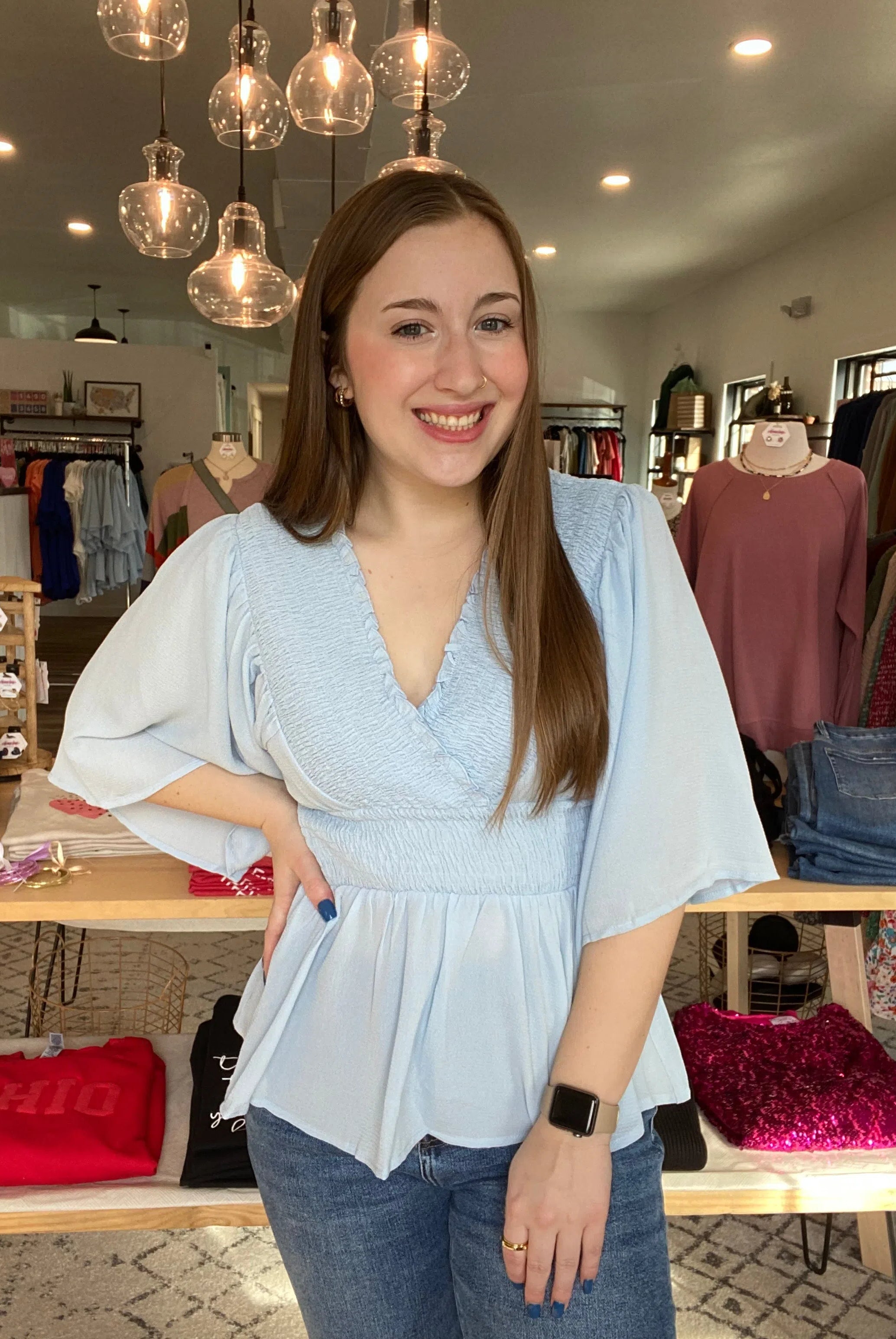 Shop Smocked Surplice Peplum Blouse - Baby Blue-Blouse at Ruby Joy Boutique, a Women's Clothing Store in Pickerington, Ohio