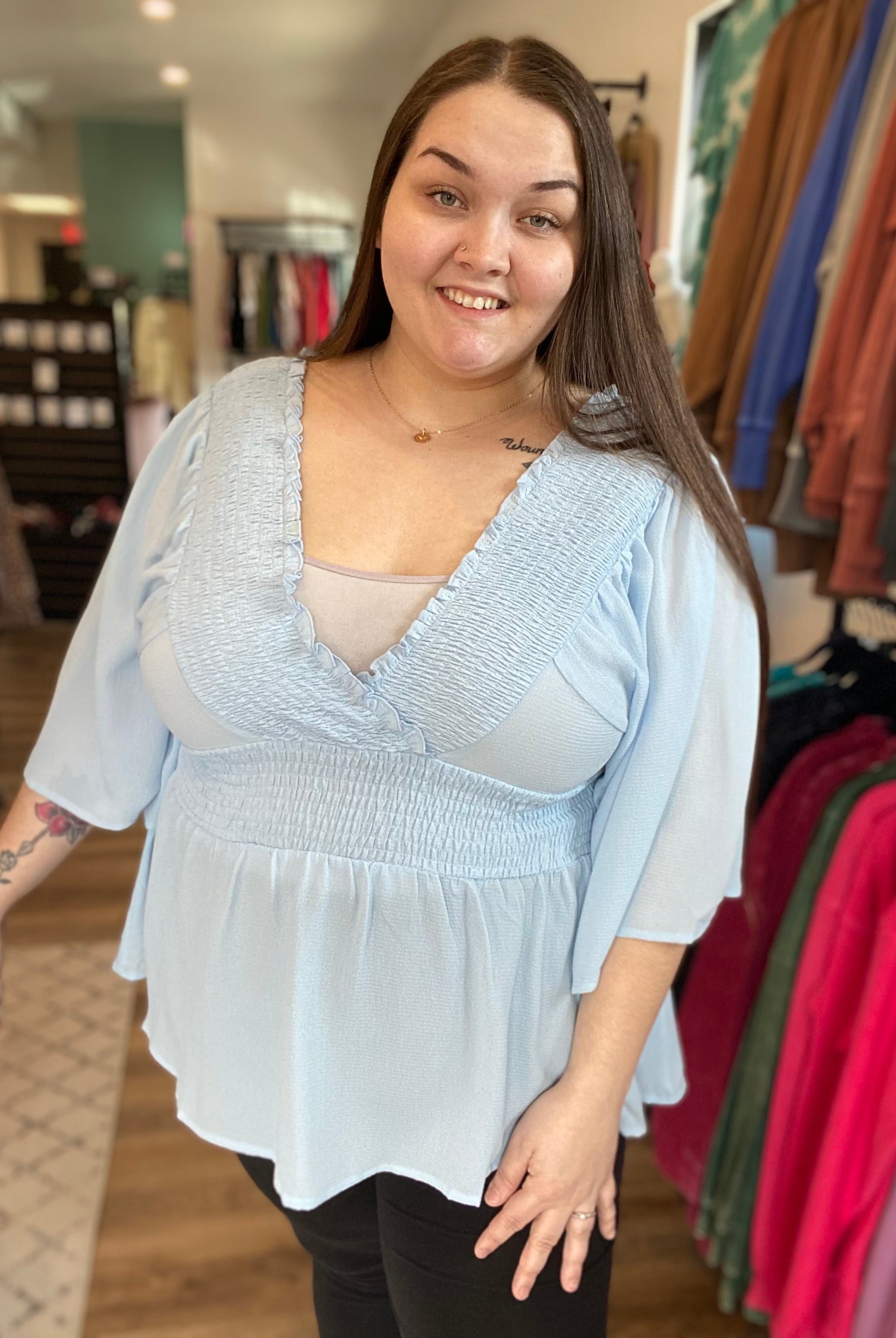 Shop Smocked Surplice Peplum Blouse - Baby Blue-Blouse at Ruby Joy Boutique, a Women's Clothing Store in Pickerington, Ohio