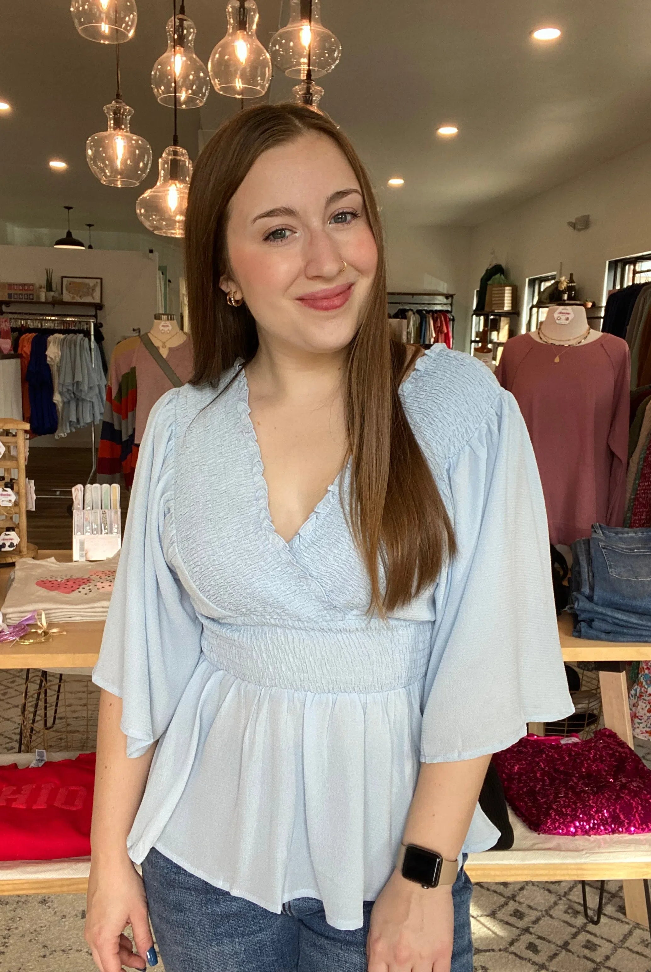 Shop Smocked Surplice Peplum Blouse - Baby Blue-Blouse at Ruby Joy Boutique, a Women's Clothing Store in Pickerington, Ohio