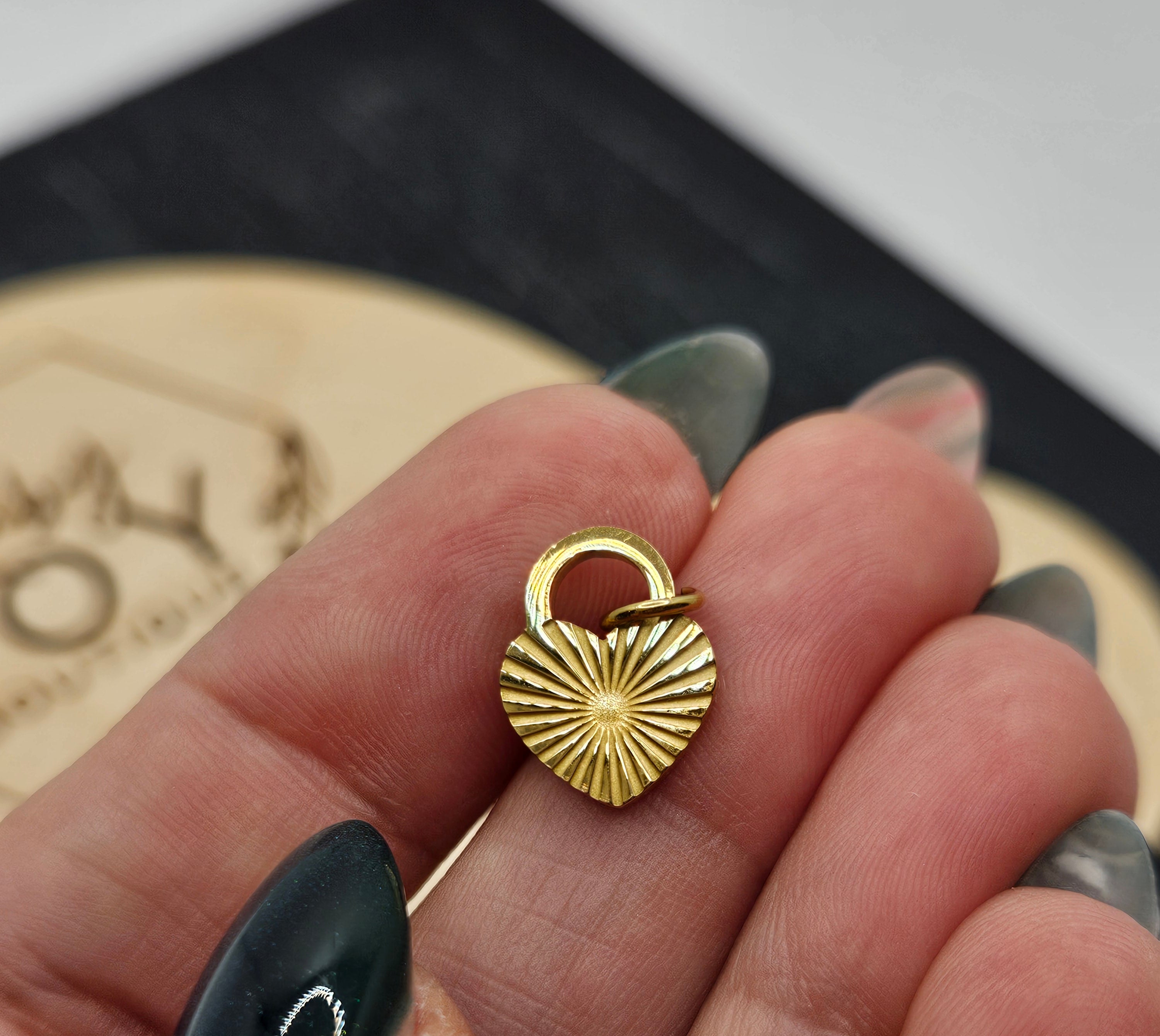 Shop Sunburst Heart Lock Charm- at Ruby Joy Boutique, a Women's Clothing Store in Pickerington, Ohio