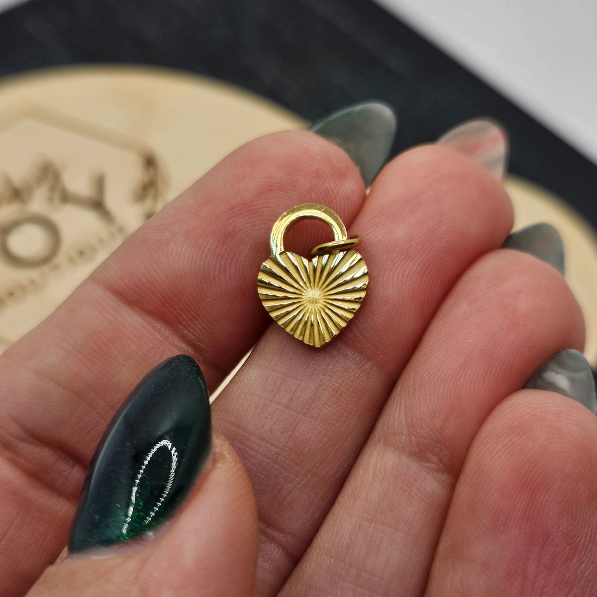 Shop Sunburst Heart Lock Charm- at Ruby Joy Boutique, a Women's Clothing Store in Pickerington, Ohio