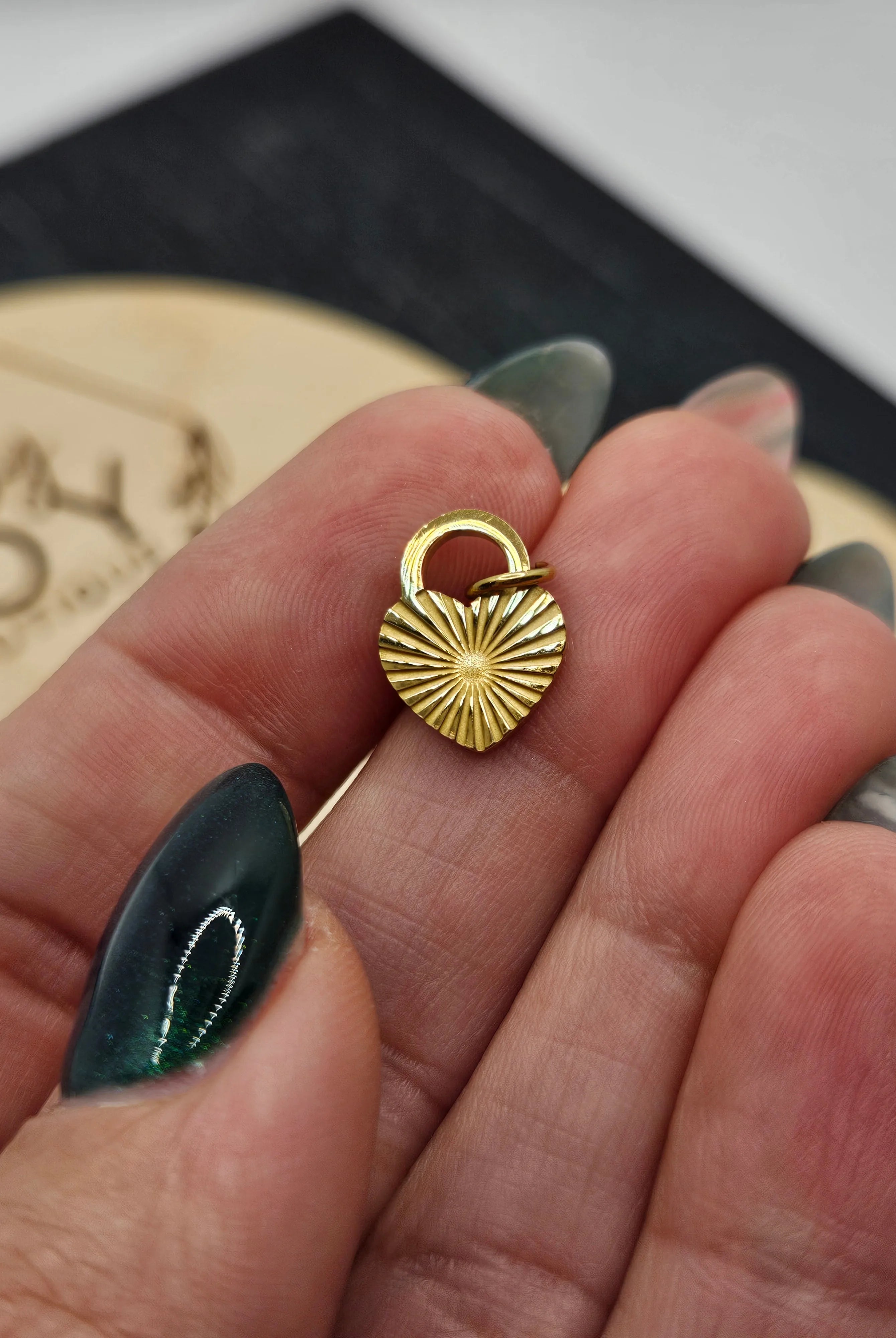 Shop Sunburst Heart Lock Charm- at Ruby Joy Boutique, a Women's Clothing Store in Pickerington, Ohio