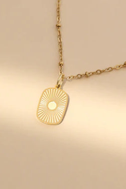 Shop Sunburst Medallion Charm- at Ruby Joy Boutique, a Women's Clothing Store in Pickerington, Ohio