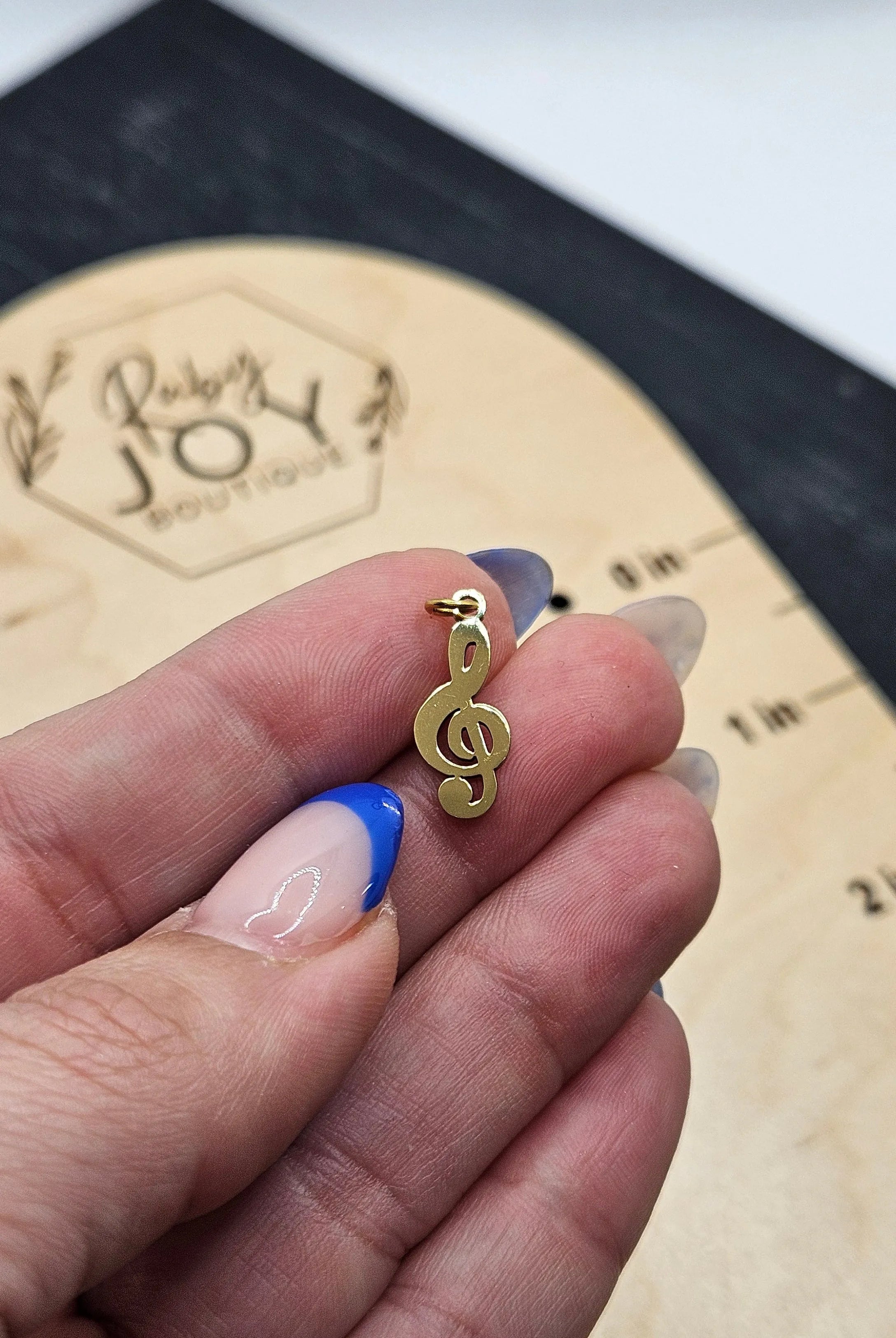 Shop Treble Clef Music Charm- at Ruby Joy Boutique, a Women's Clothing Store in Pickerington, Ohio