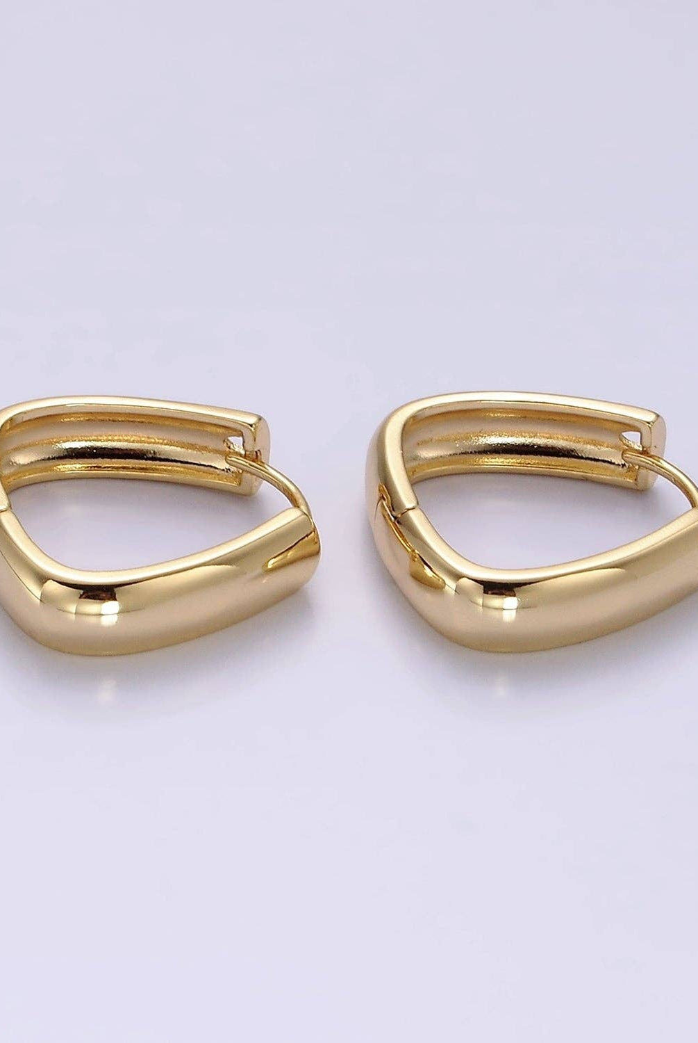 Shop Triangle Huggie Earrings- at Ruby Joy Boutique, a Women's Clothing Store in Pickerington, Ohio
