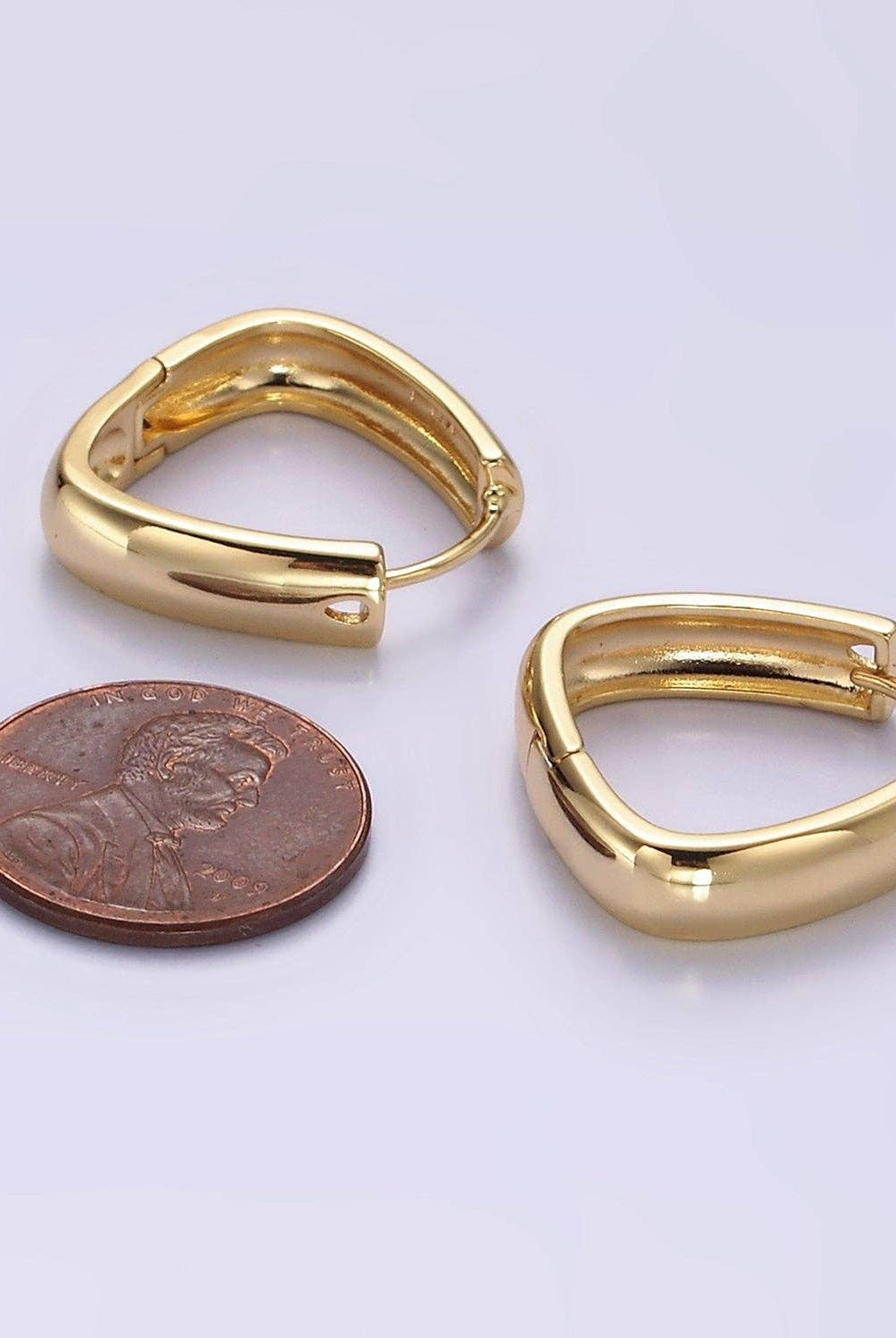 Shop Triangle Huggie Earrings- at Ruby Joy Boutique, a Women's Clothing Store in Pickerington, Ohio