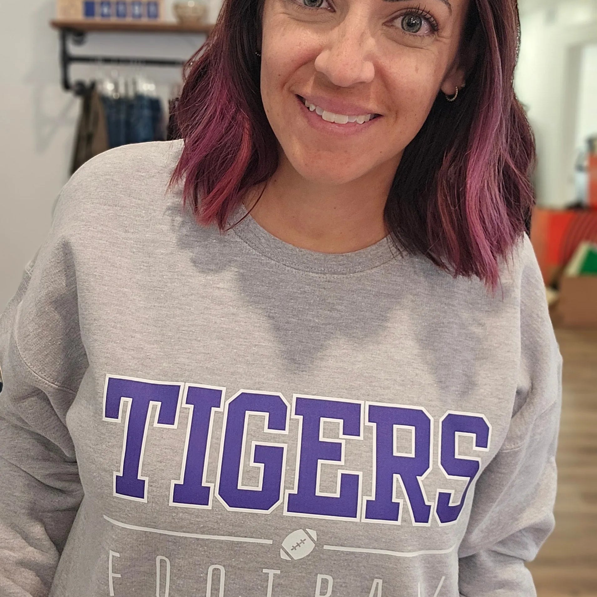 Shop Varsity Football Mascot Sweatshirt- at Ruby Joy Boutique, a Women's Clothing Store in Pickerington, Ohio