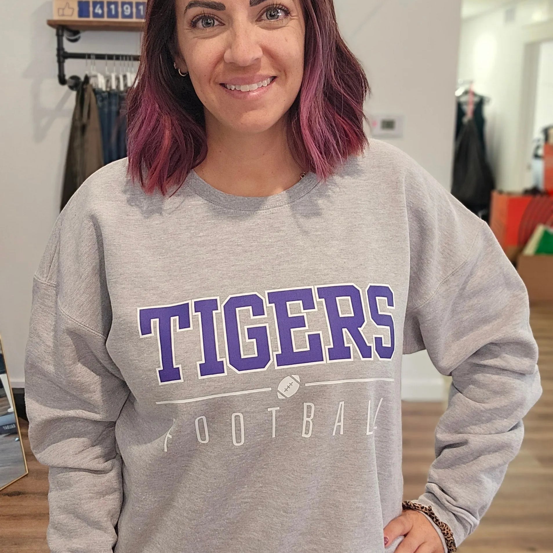 Shop Varsity Football Mascot Sweatshirt- at Ruby Joy Boutique, a Women's Clothing Store in Pickerington, Ohio
